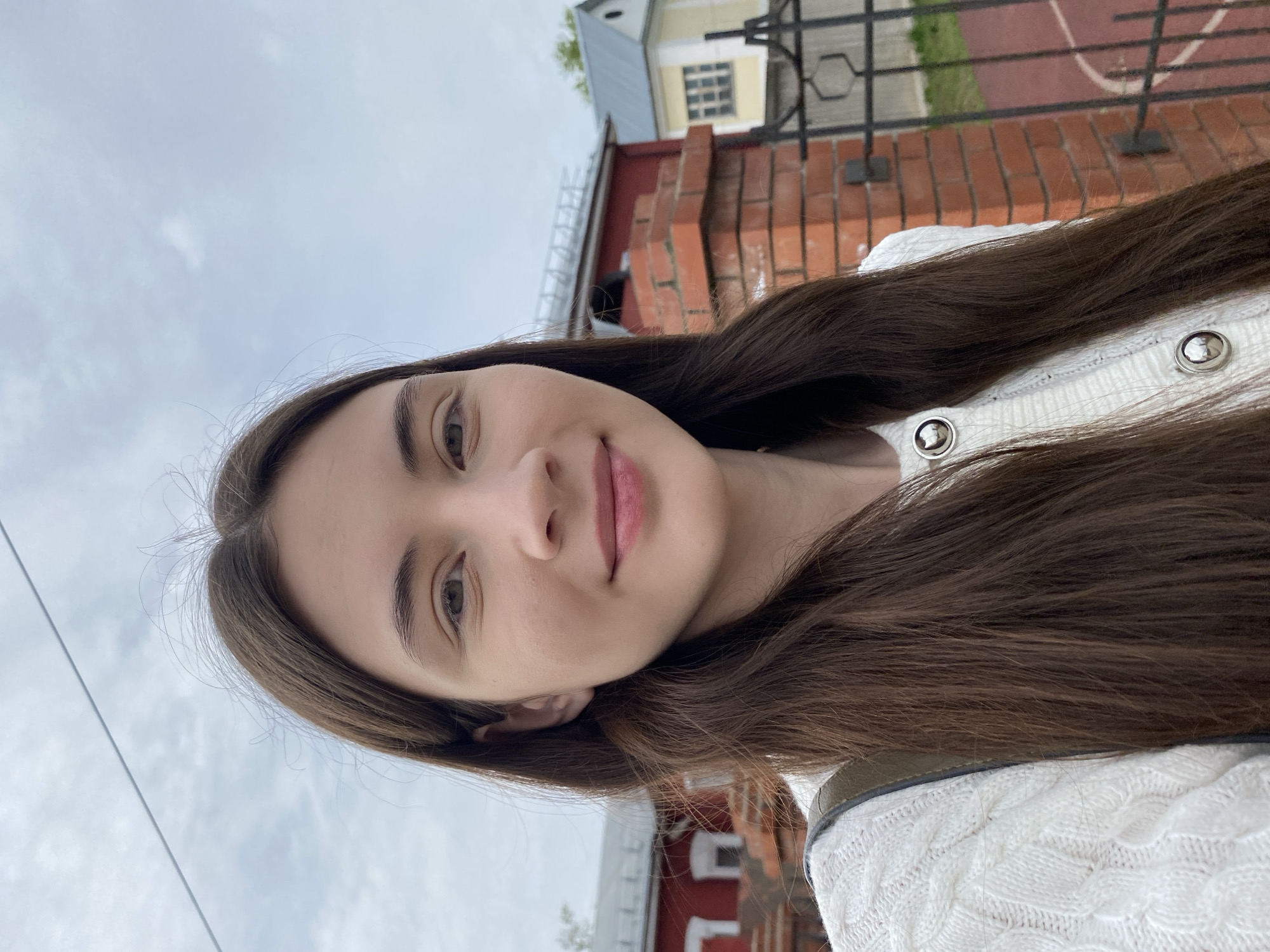 Woman takes morning selfies near cathedral in Votkinsk, Russia