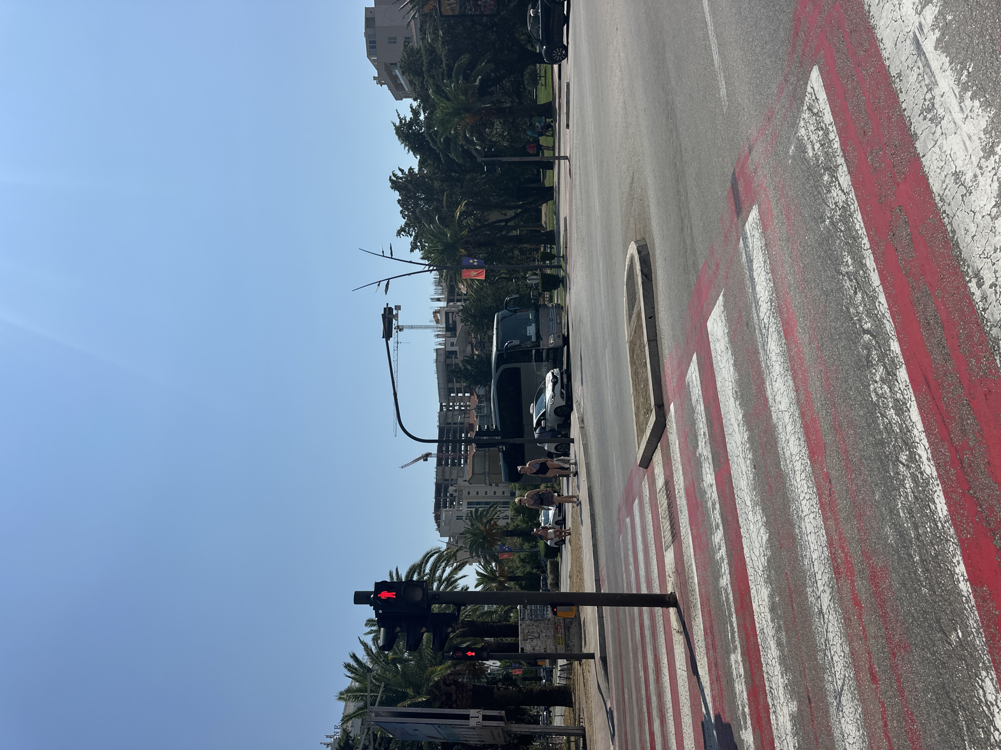 Sunny afternoon street scene at a Budva intersection