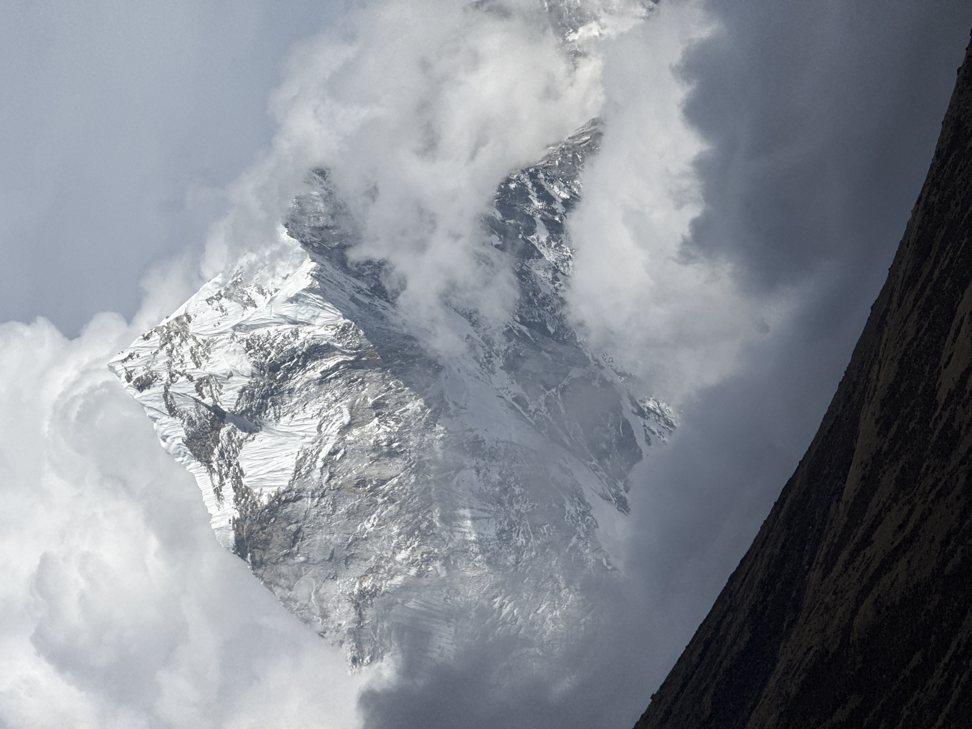 Himalayan peaks photographed through clouds near Khumjung, Nepal