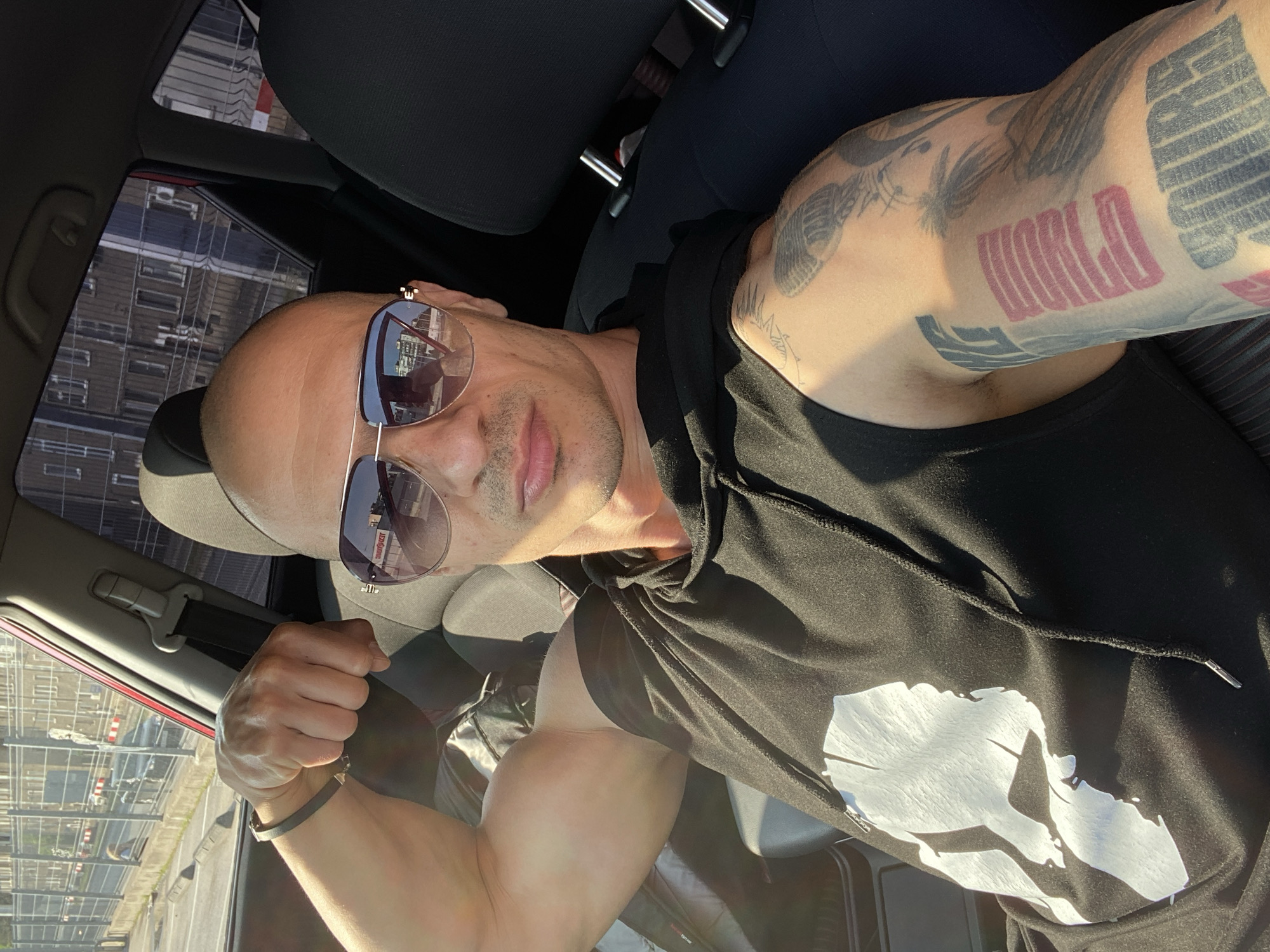 Tattooed man takes multiple selfies in Pleven, Bulgaria morning
