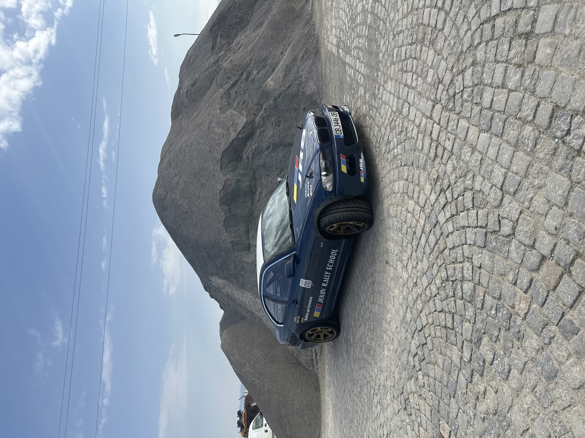 Rally school BMW spotted on cobblestone street in Negovan