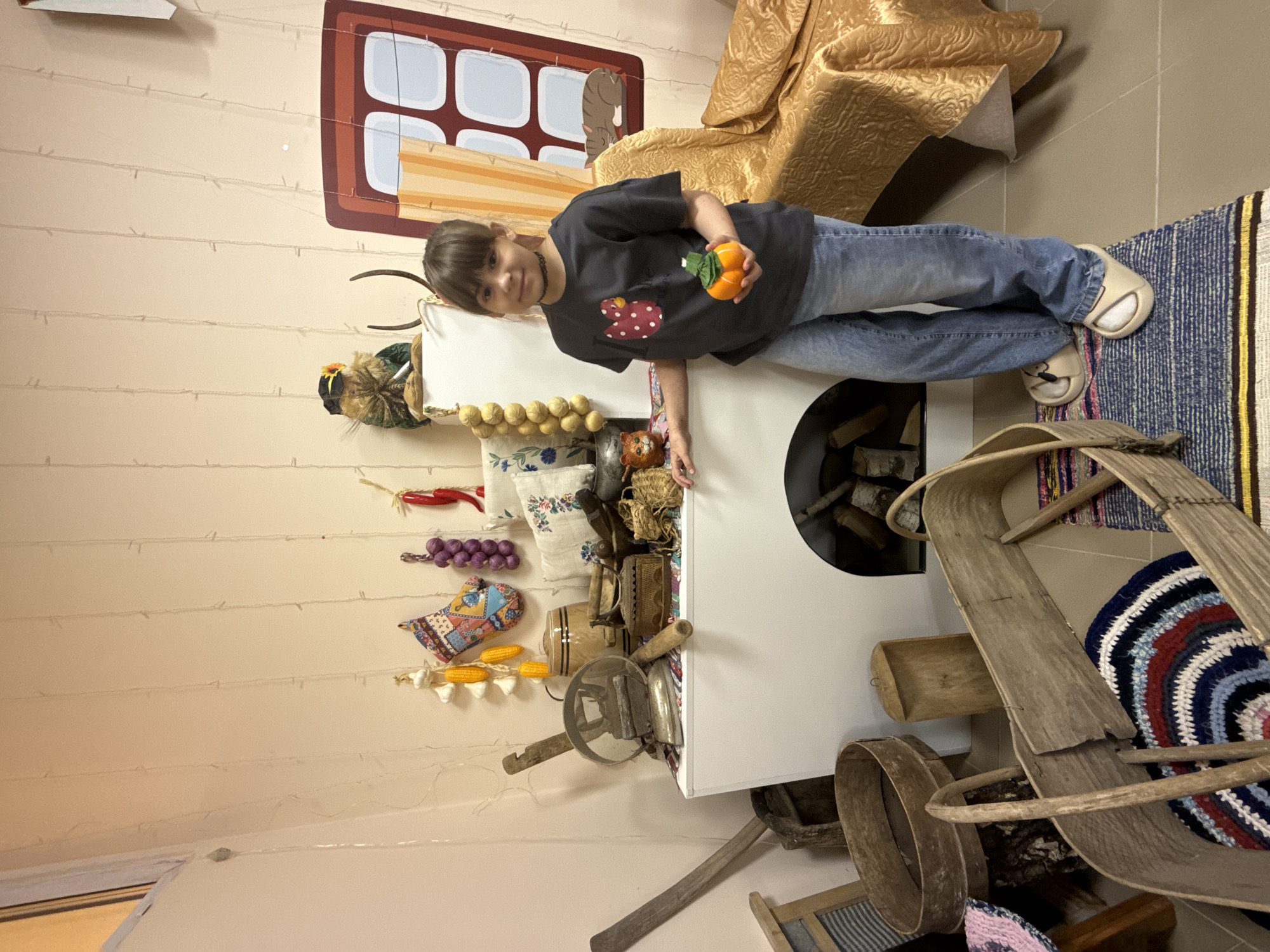 Child visits traditional Russian interior exhibit in Rusanovo museum
