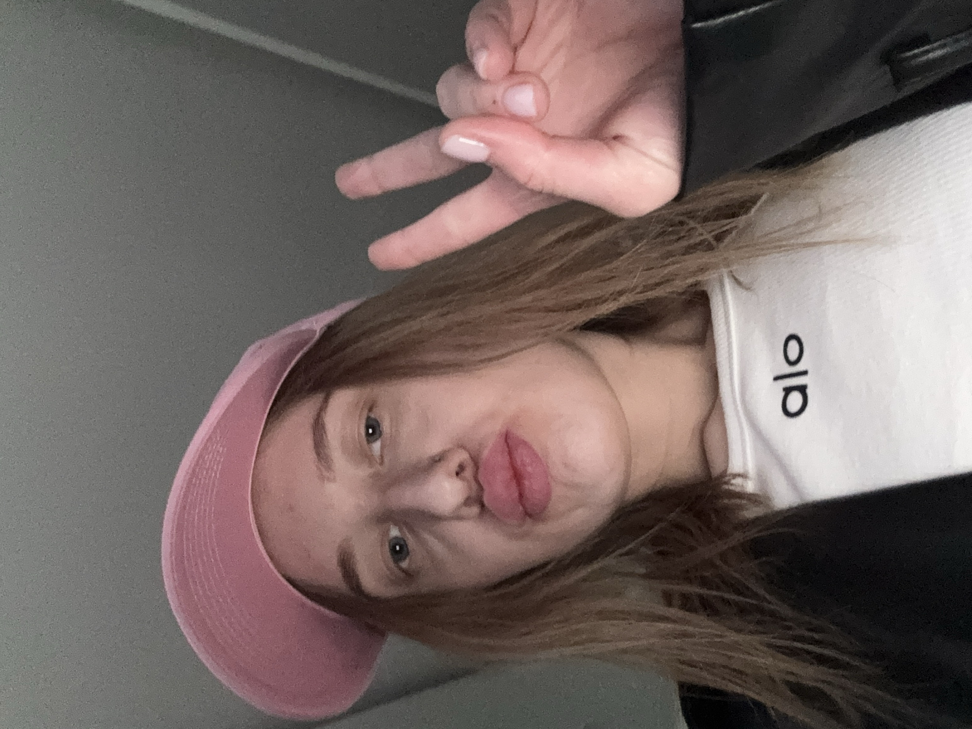 Woman takes selfie in pink cap in Rostov-on-Don