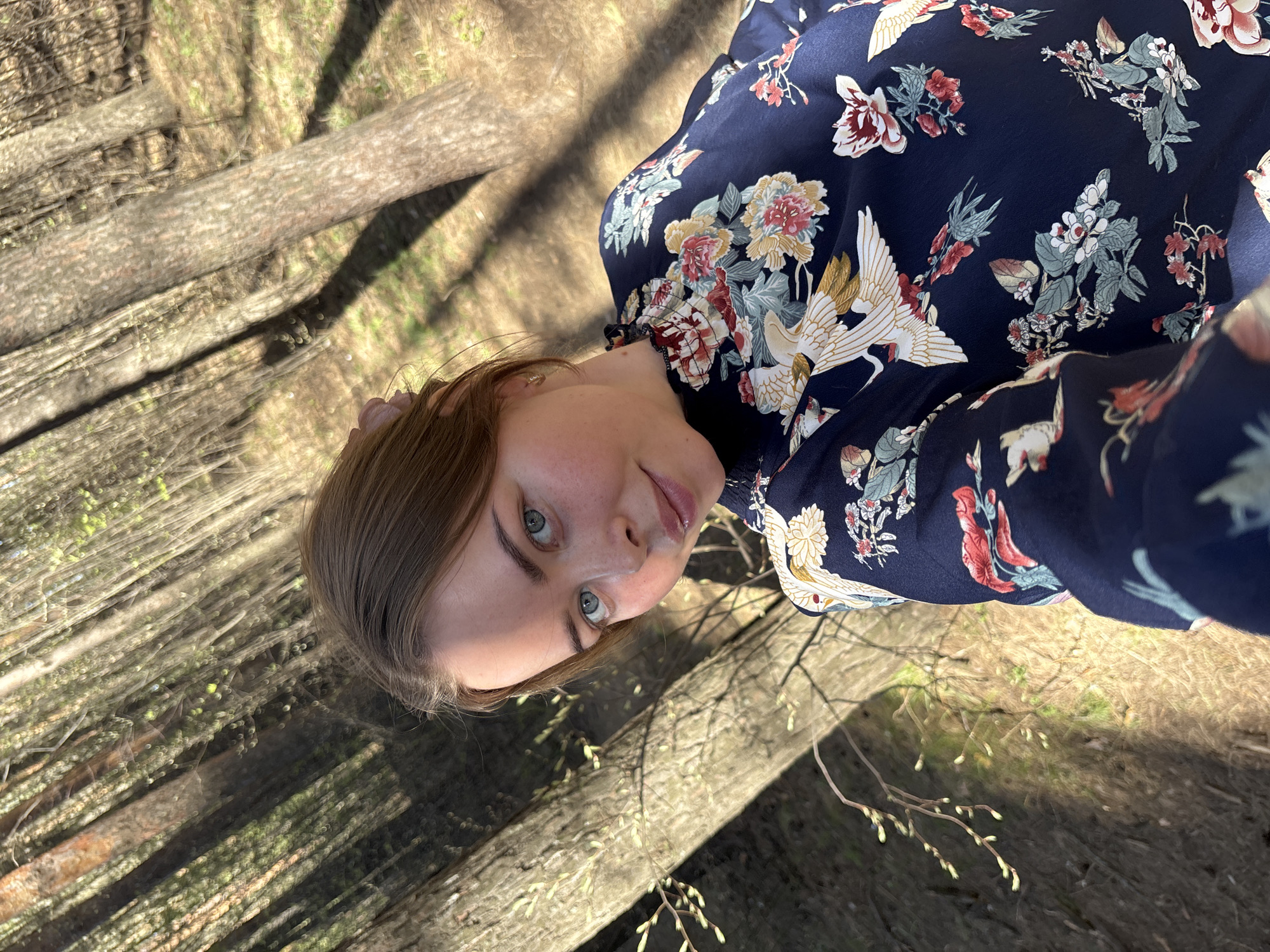 Woman takes selfie in spring forest in Izhevsk