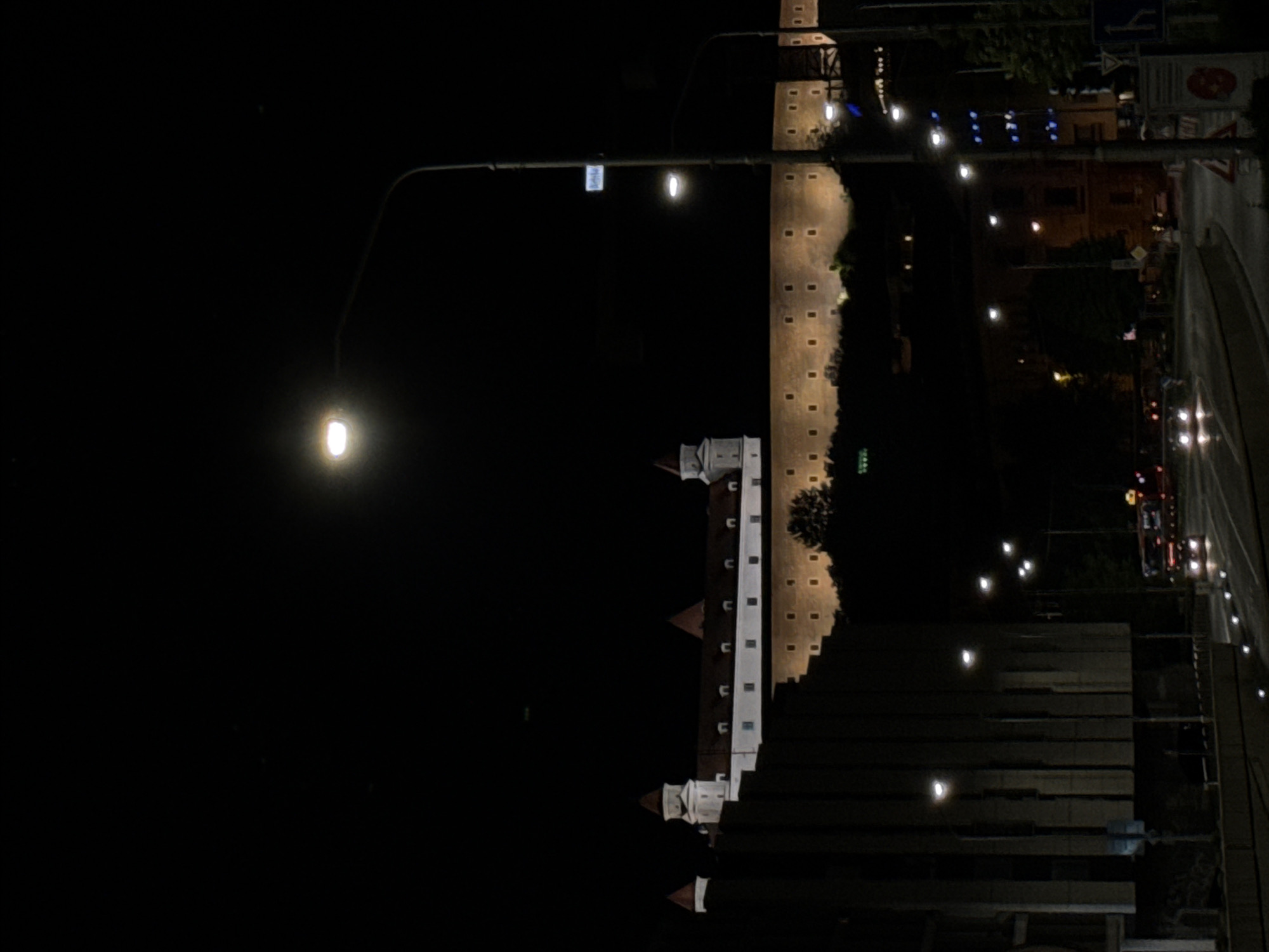 Nighttime view captured of illuminated Bratislava Castle and historic walls