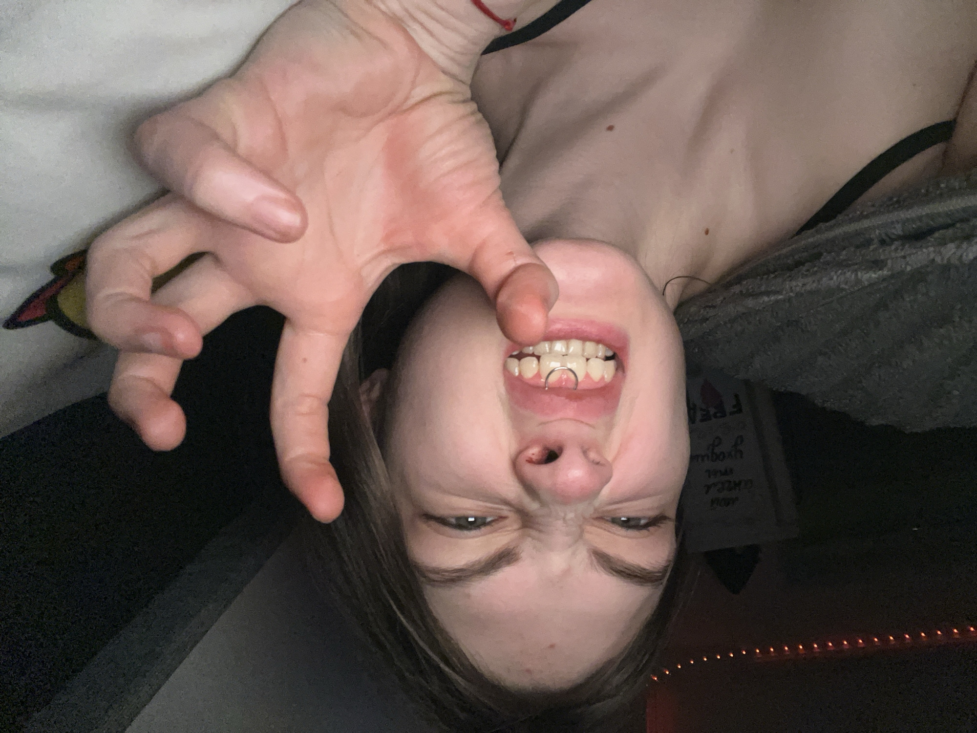Person captured upside down making claw gesture in Saint Petersburg