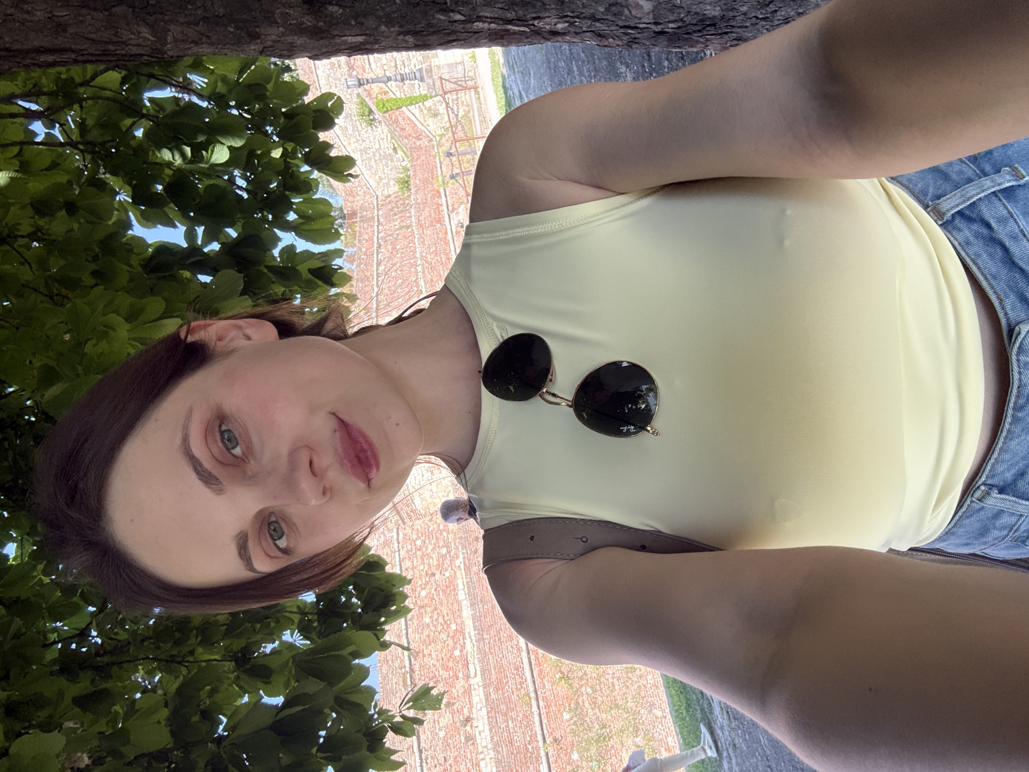 Woman takes selfie near brick structure in Belgrade