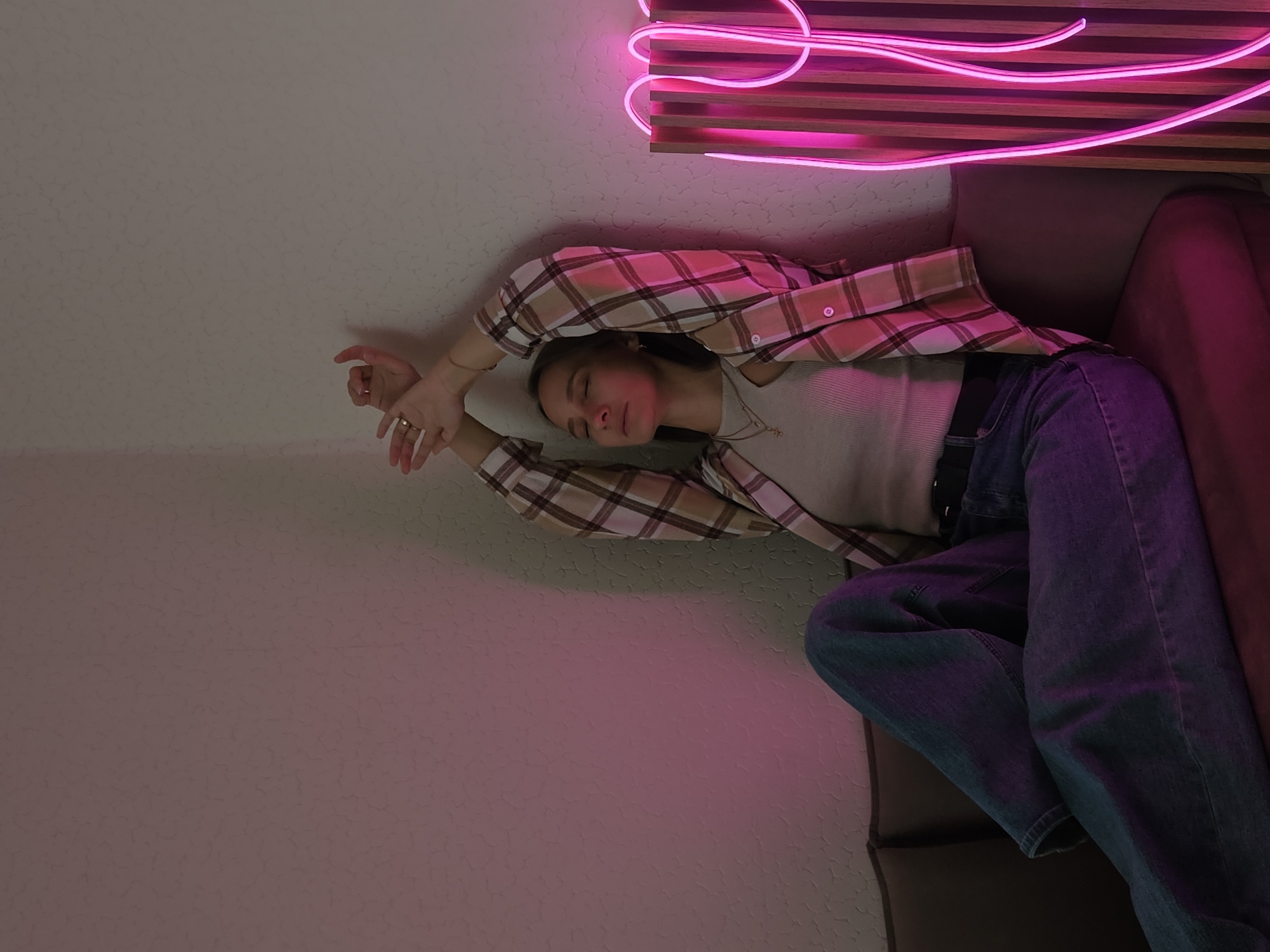 Woman photographed in various indoor poses in Chaikovsky, Russia