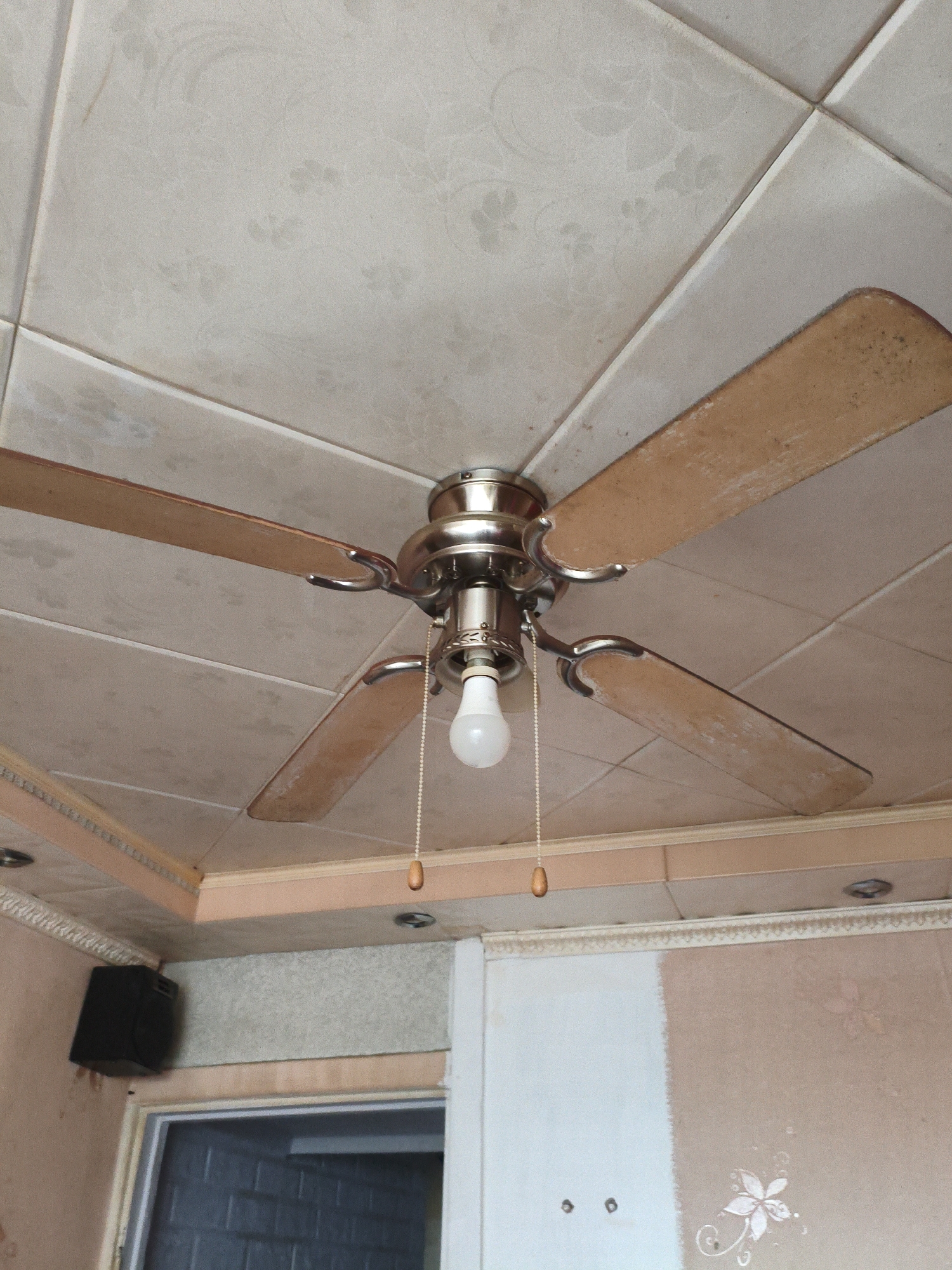 Indoor ceiling fixtures and a suspended projector, close up