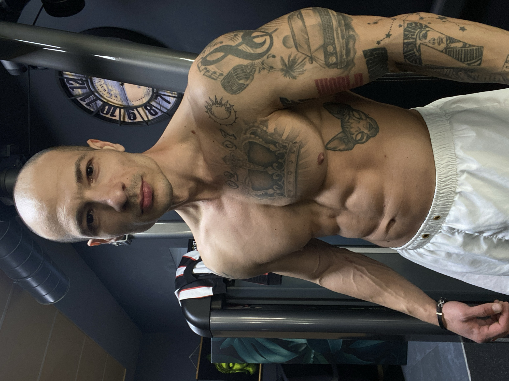 Tattooed man exercises at Pleven gym Friday afternoon