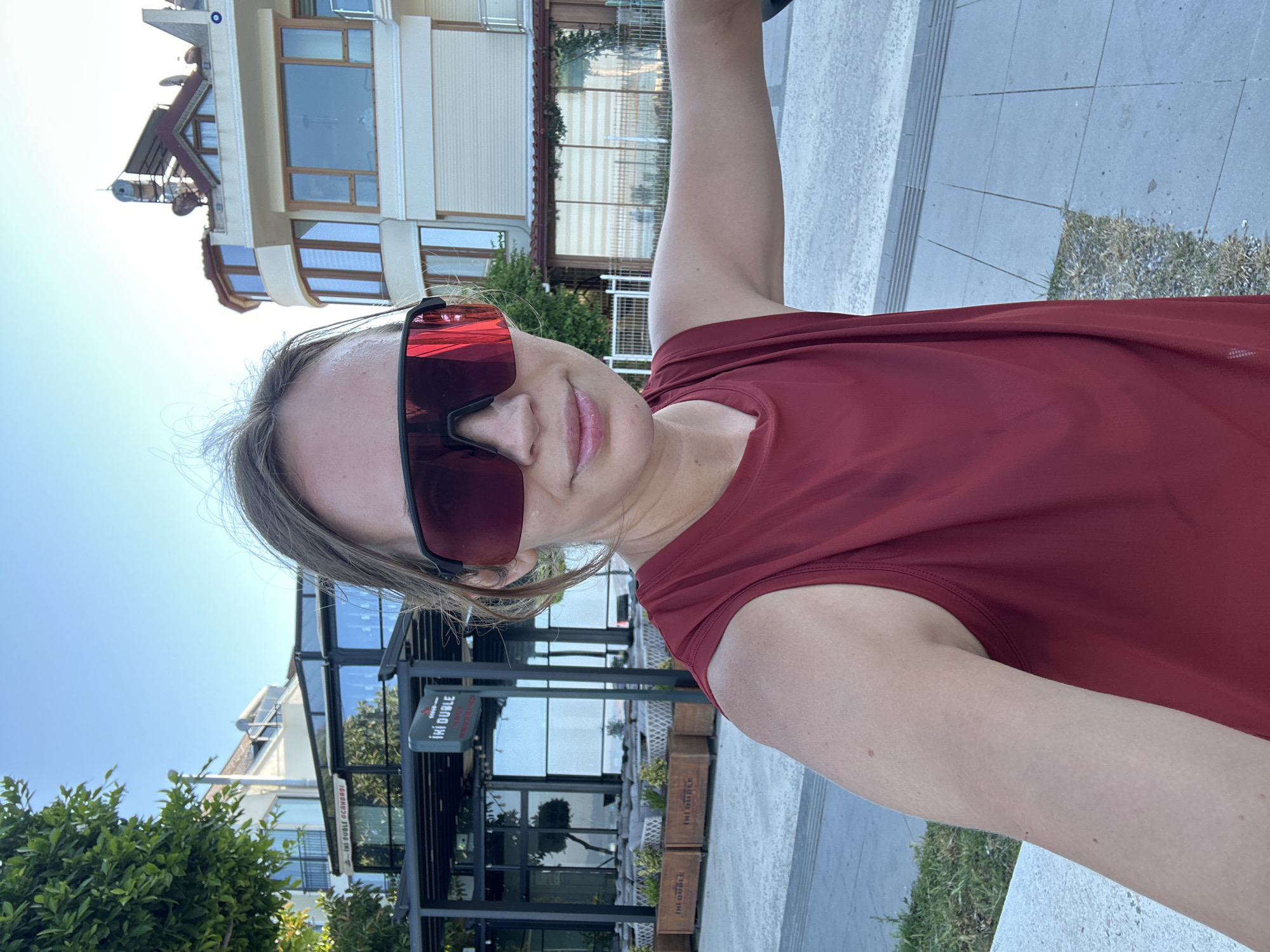 Tourist photographs Fethiye harbor and waterfront during early morning visit