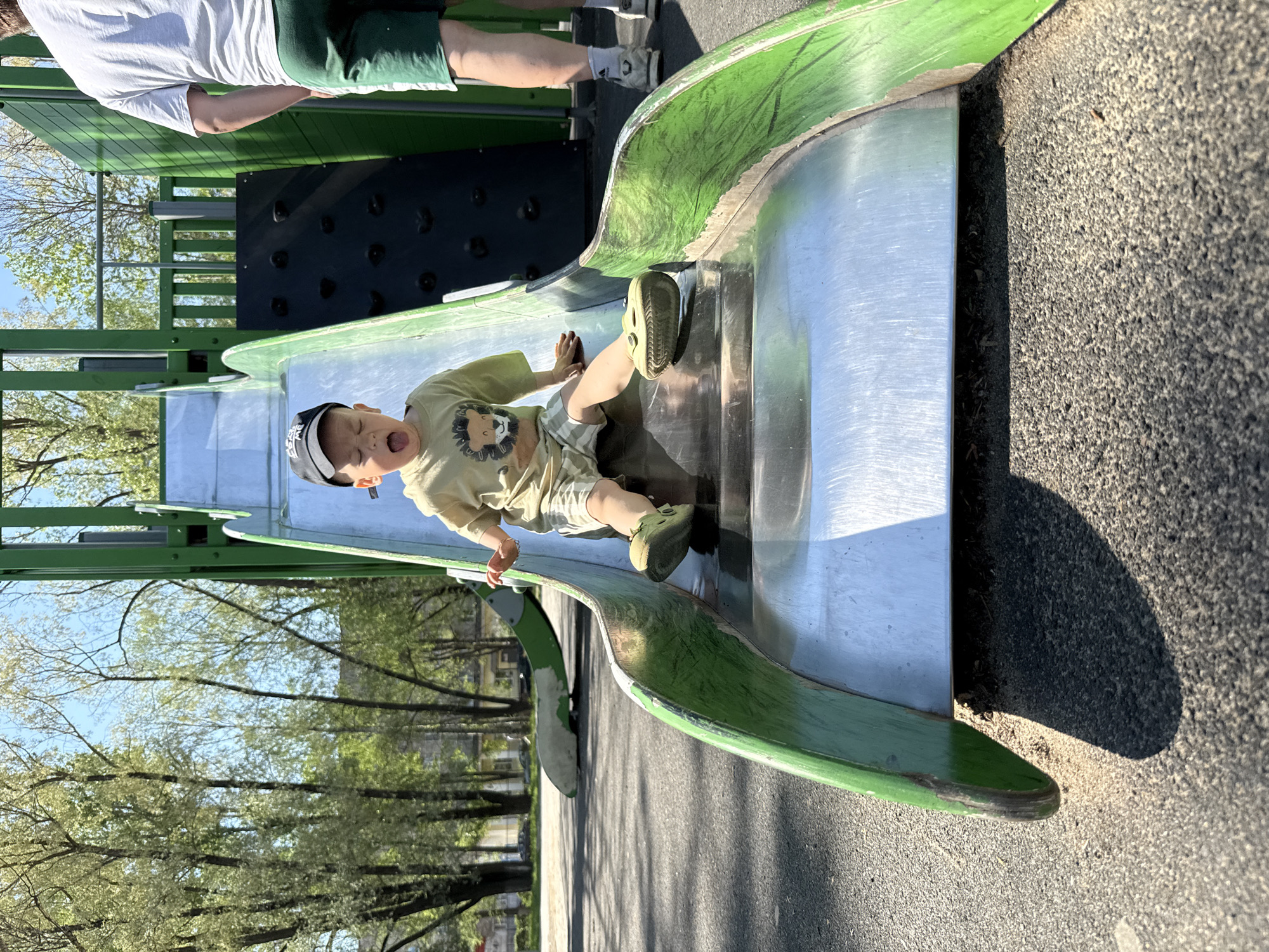 Child plays on playground slide in Rusanovo, Russia