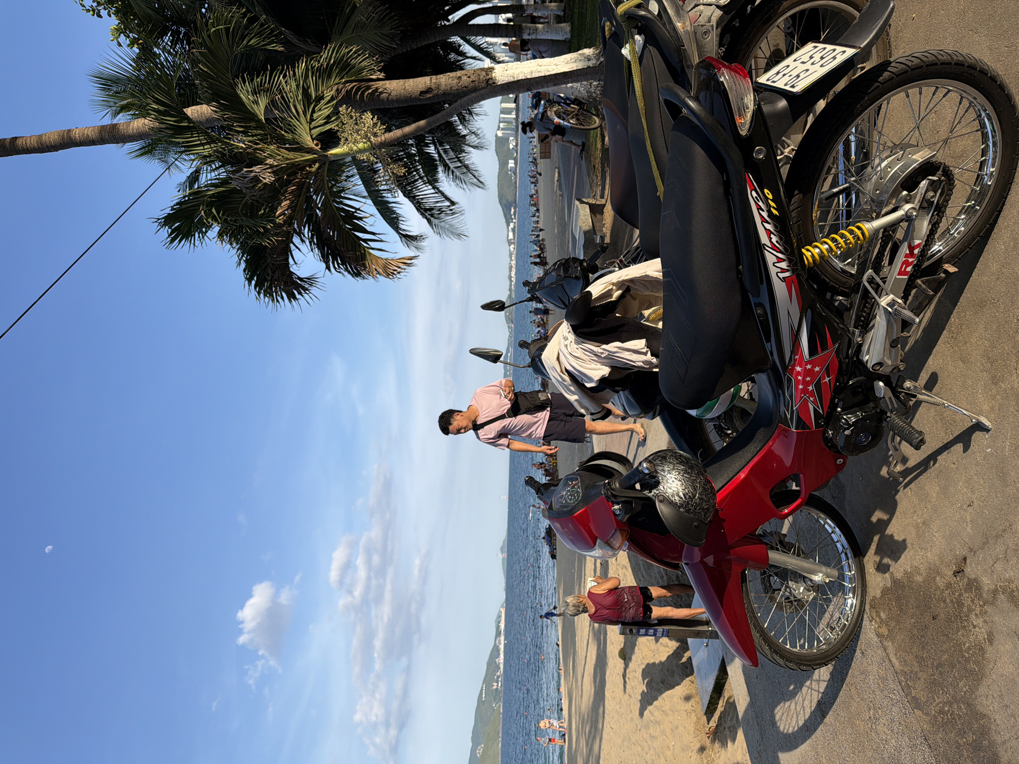Busy morning at Nha Trang beach, wedding arch and all