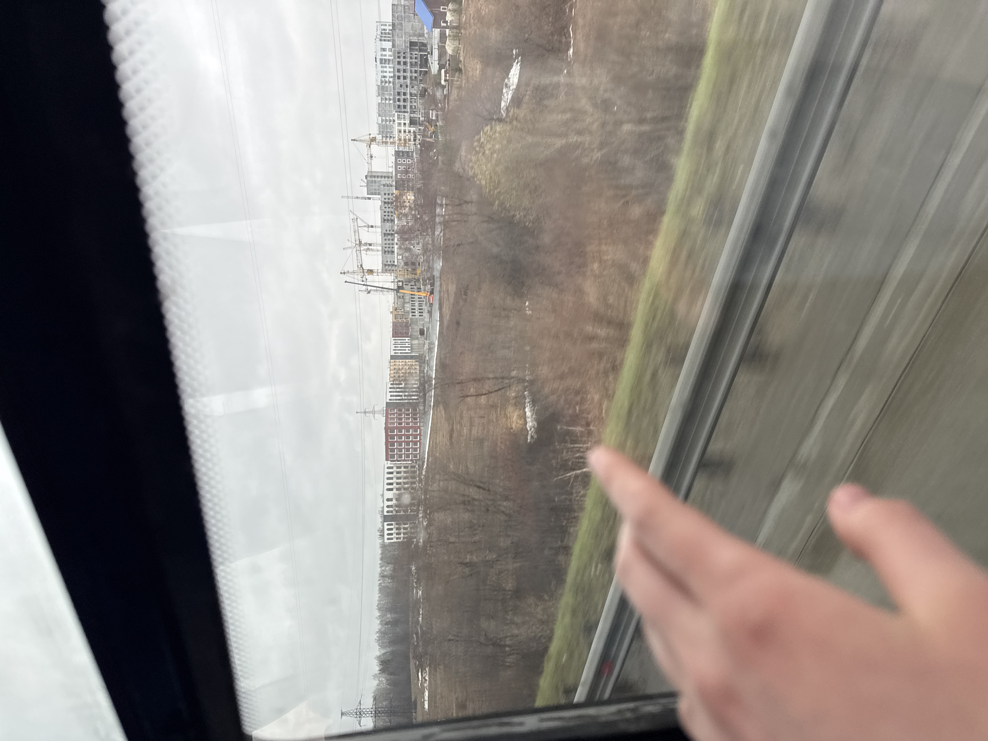 Train passenger documents construction and cityscape views in Froly