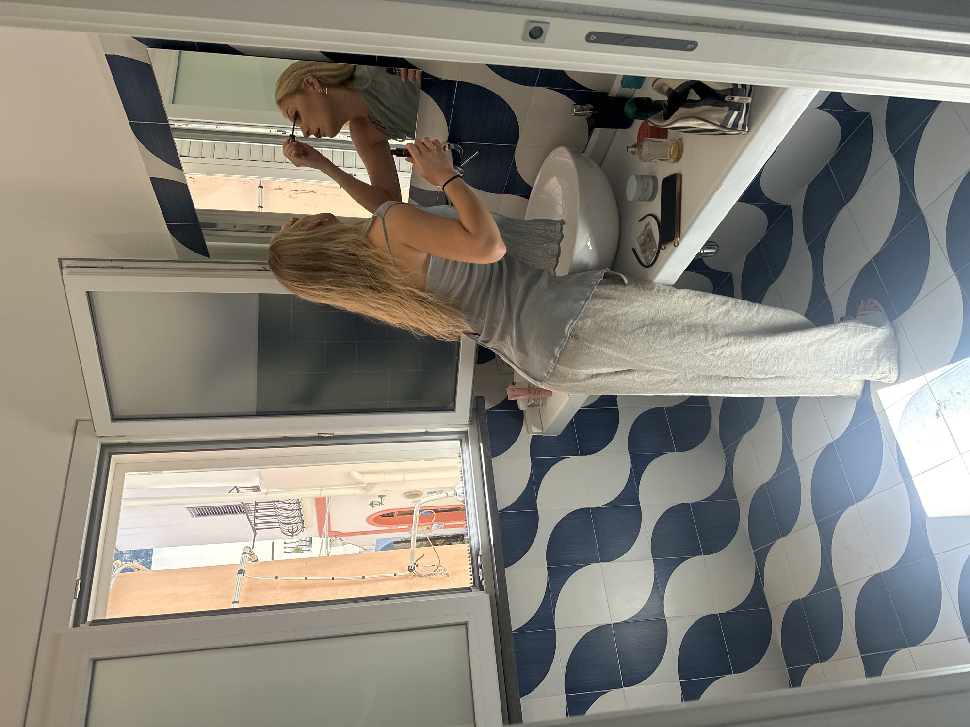 Morning routine captured on Italian island balcony overlooking sea