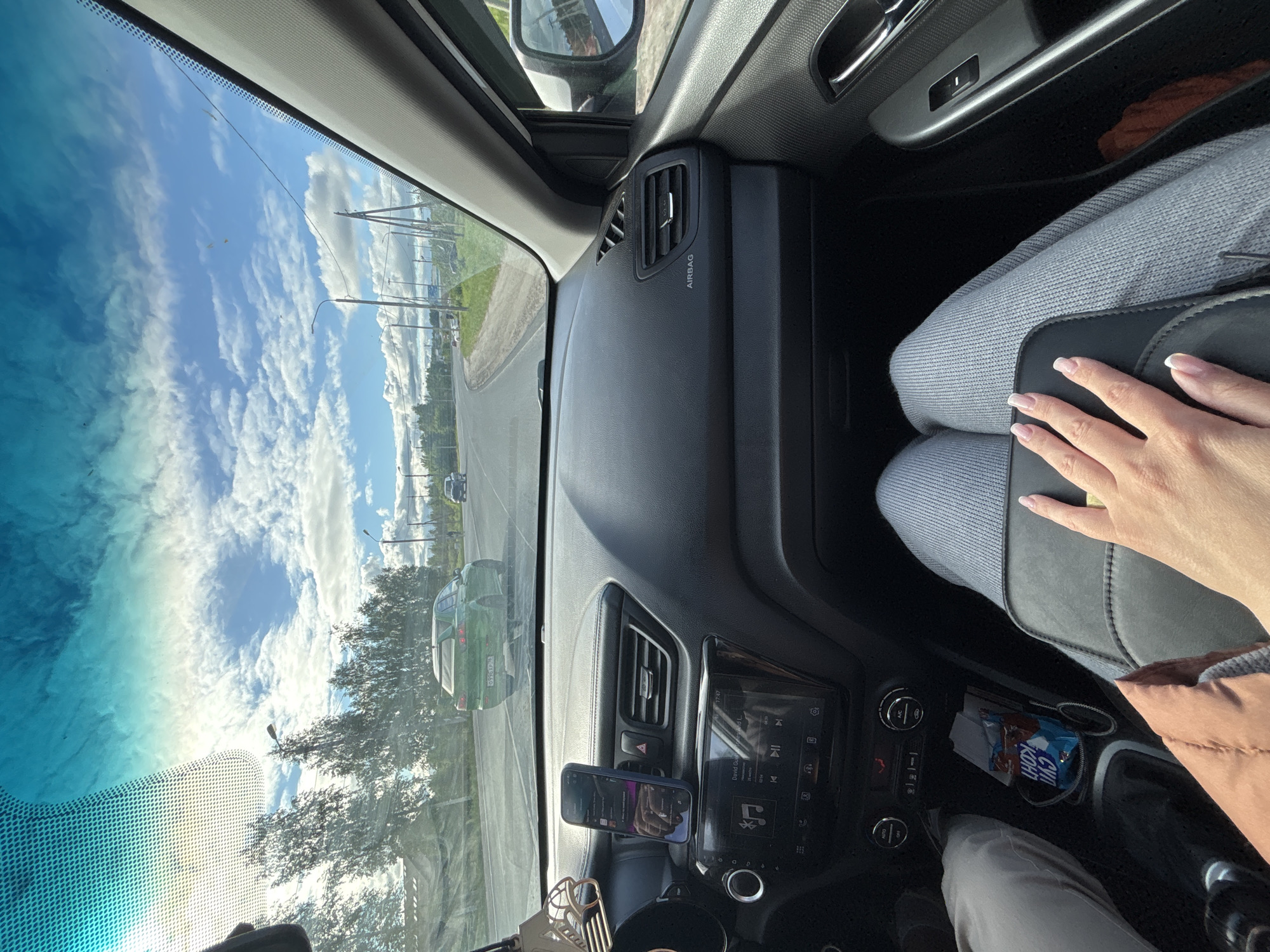 Car journey documented through Yaroslavl on sunny afternoon