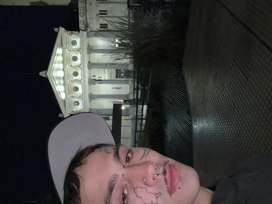Late night activity around illuminated Buenos Aires school building