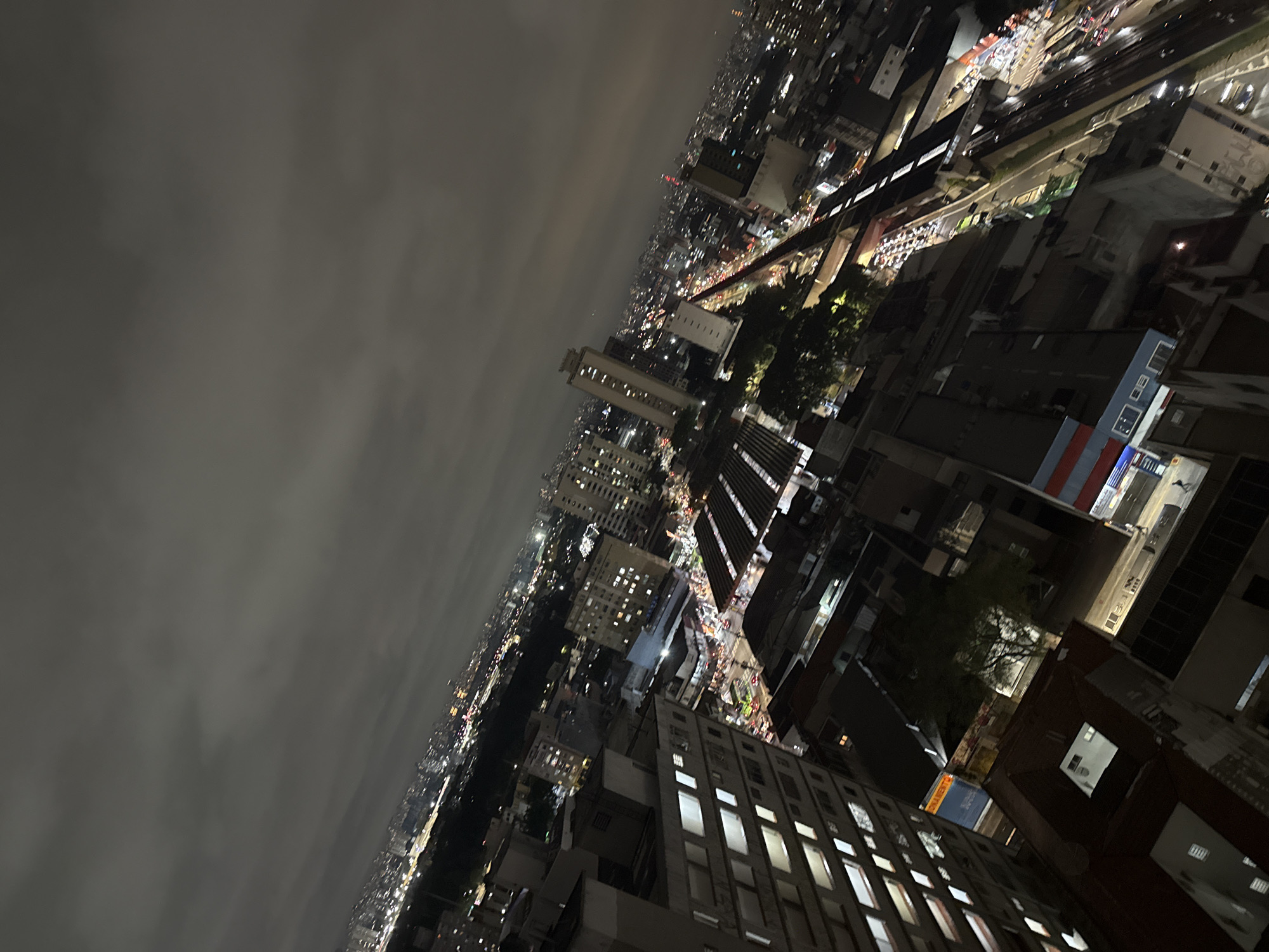 Nighttime São Paulo captured from aerial and street perspectives