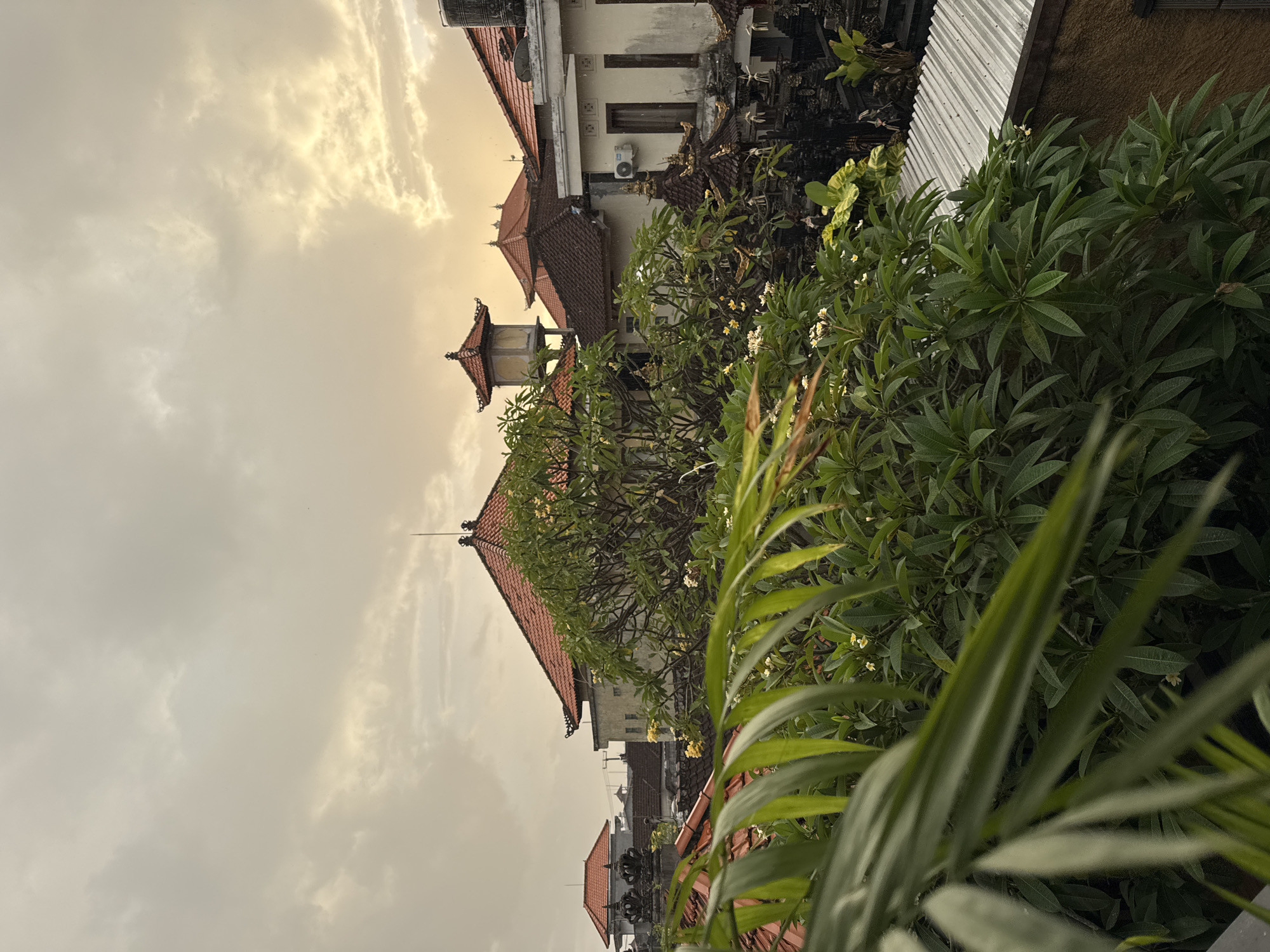 Evening scenes of traditional architecture and frangipani flowers in Kuta