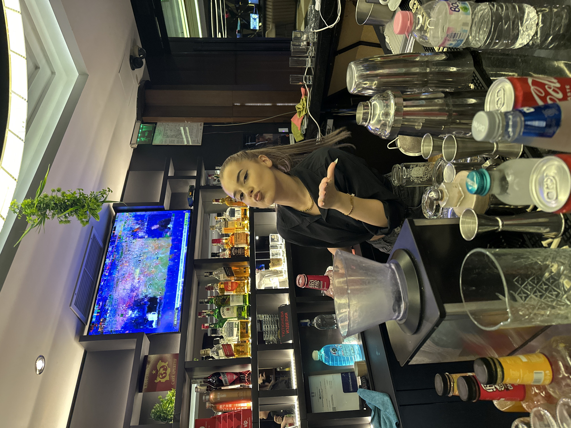 Bar staff prepping drinks during an evening shift at a branded venue