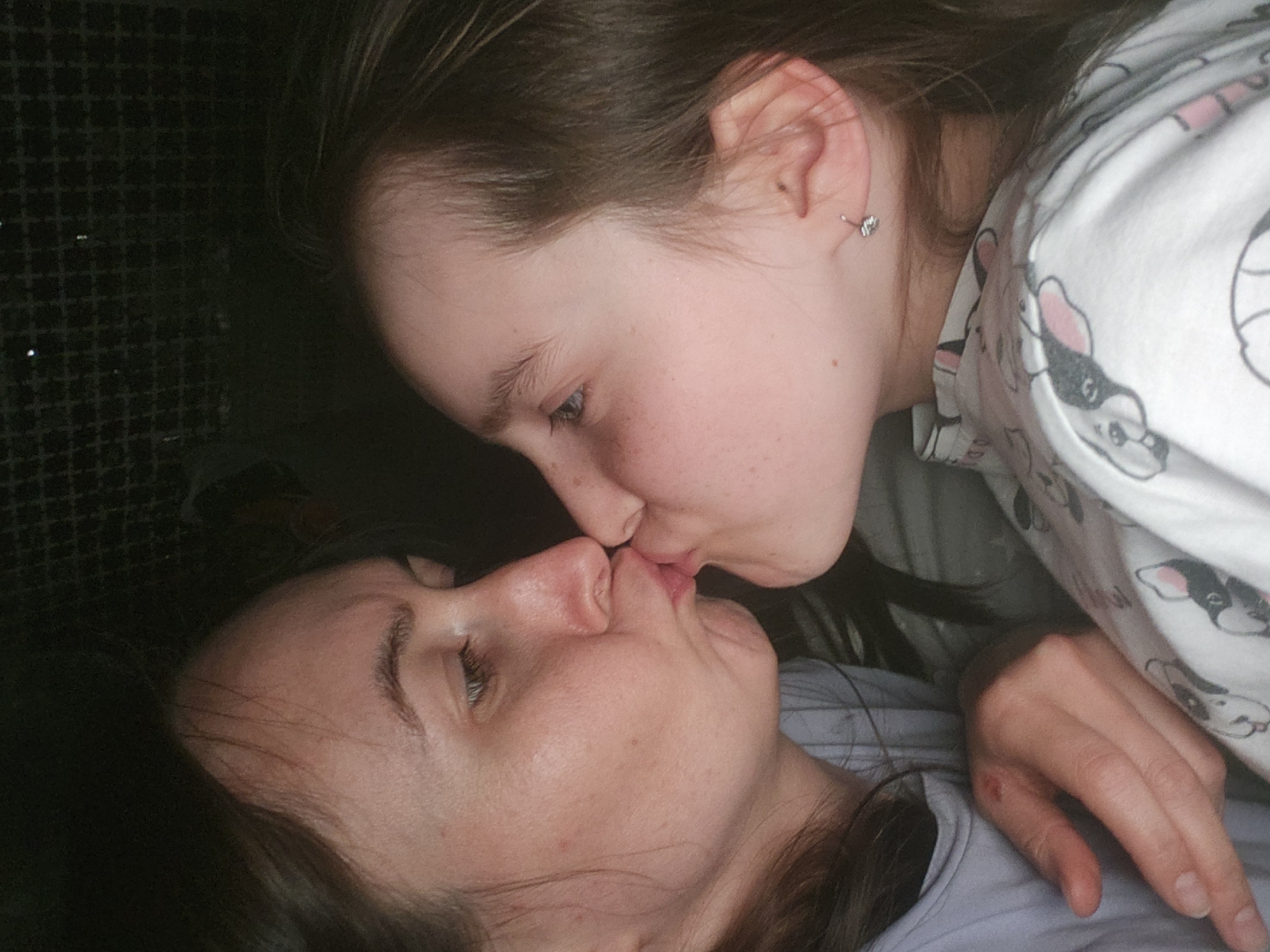 Mother and daughter share bedtime moment in Krasnogorskoye