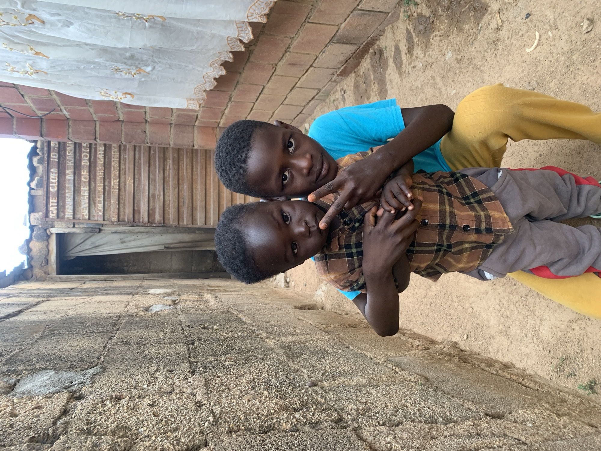 Daily life unfolds on Jos streets: children, vendors, residents