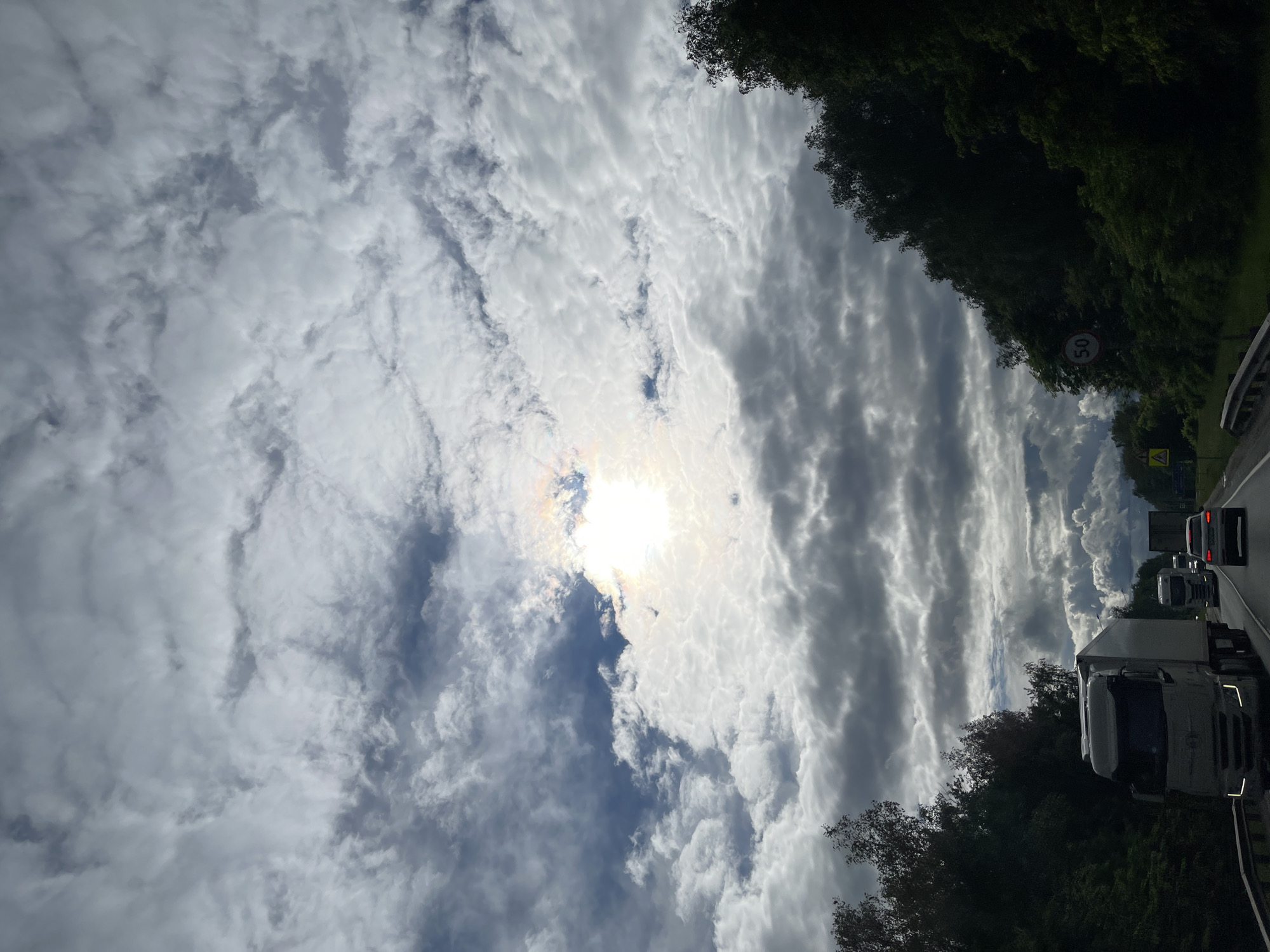 Cloudy skies observed during highway travel near Ol'khovka, Russia