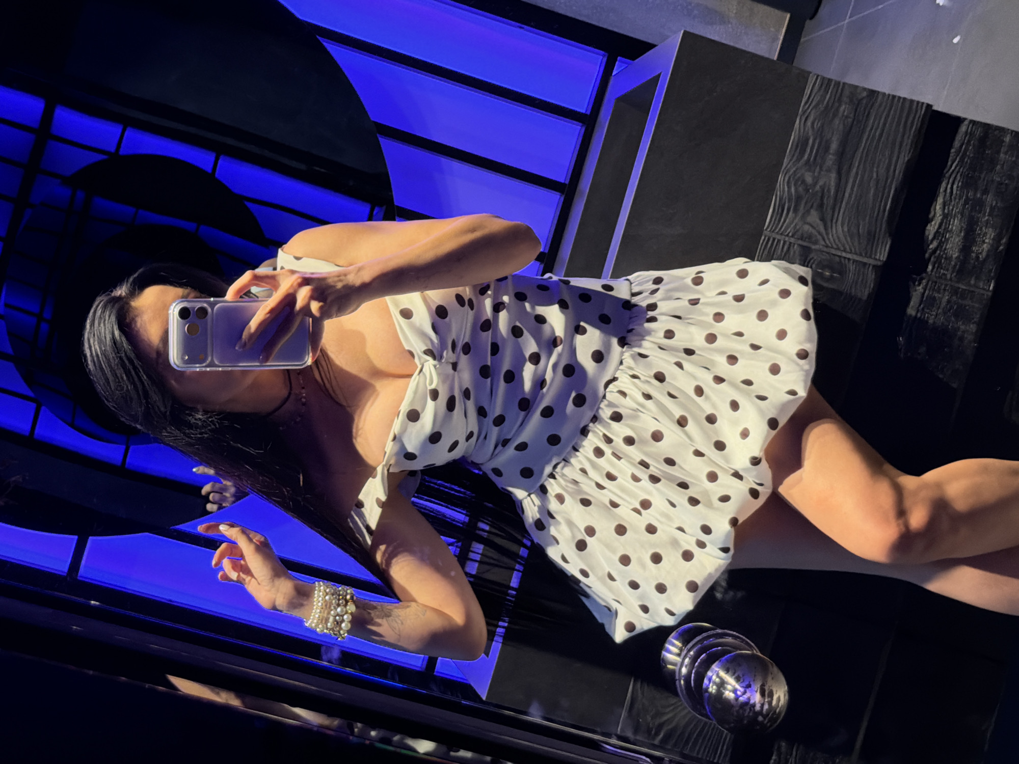 Woman takes selfie in polka dot dress, Podgorica