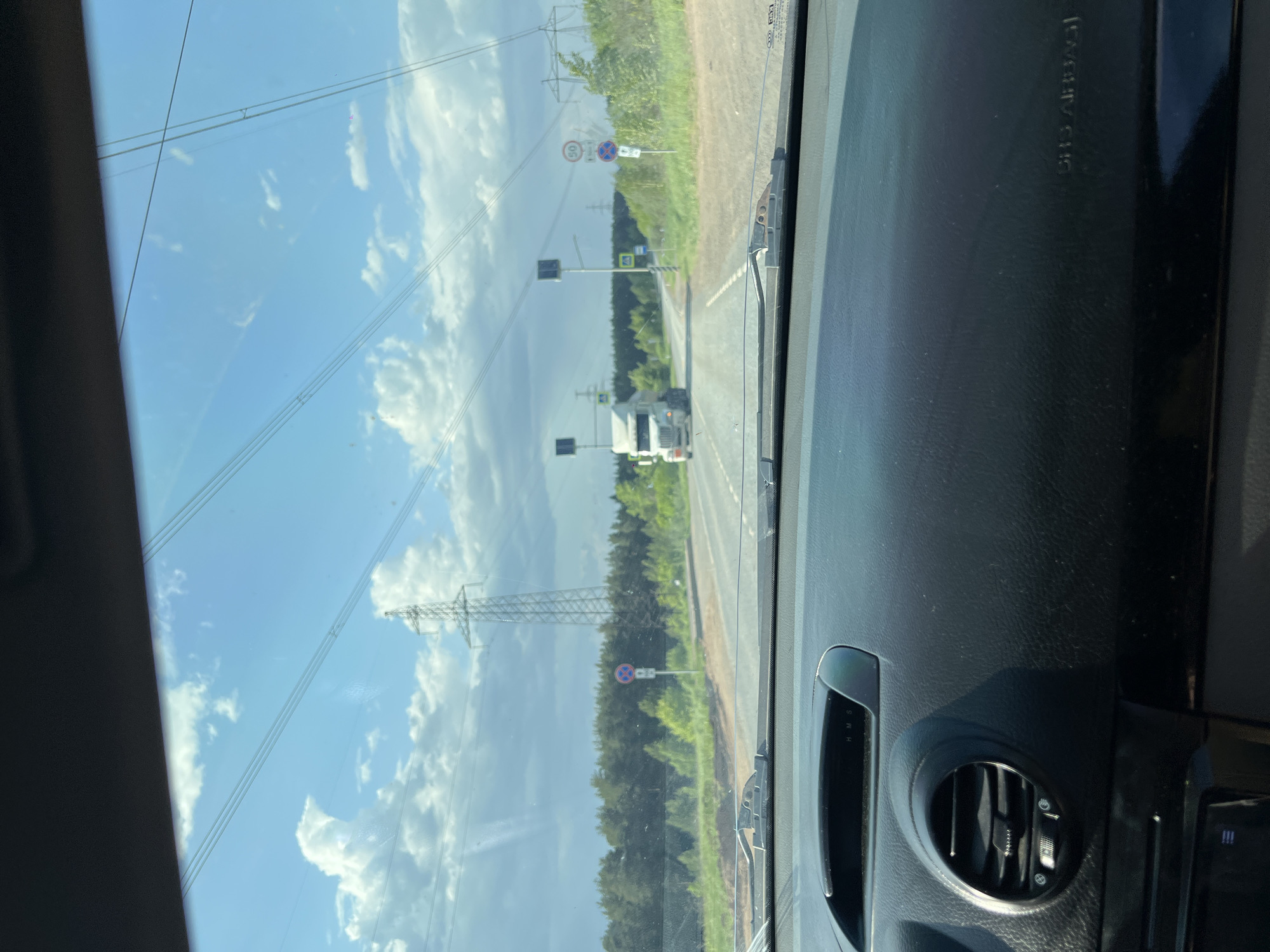 White truck spotted on Chaikovsky road amid cloudy afternoon