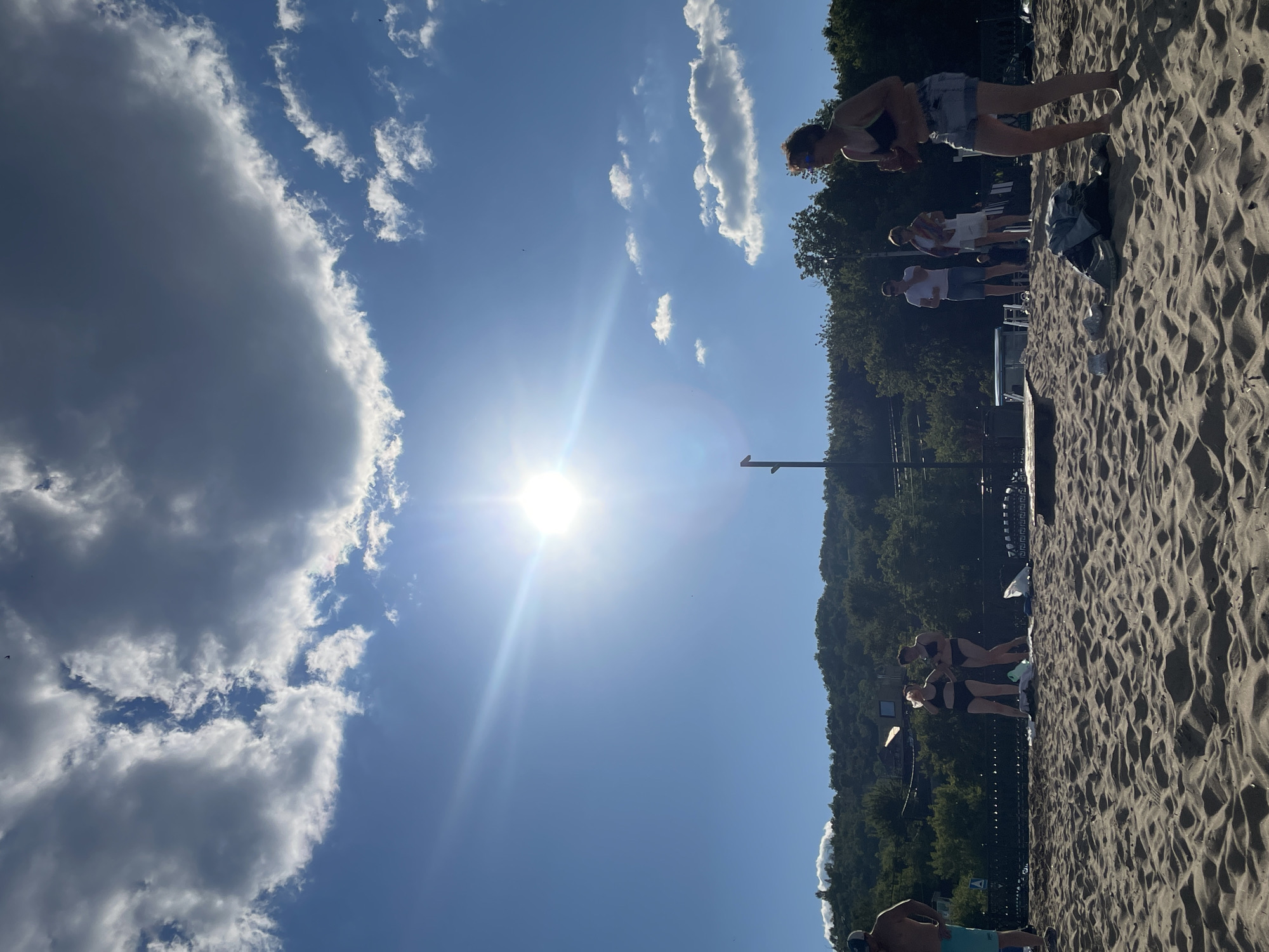 Packed Volga beach day in Saratov on a hot July afternoon