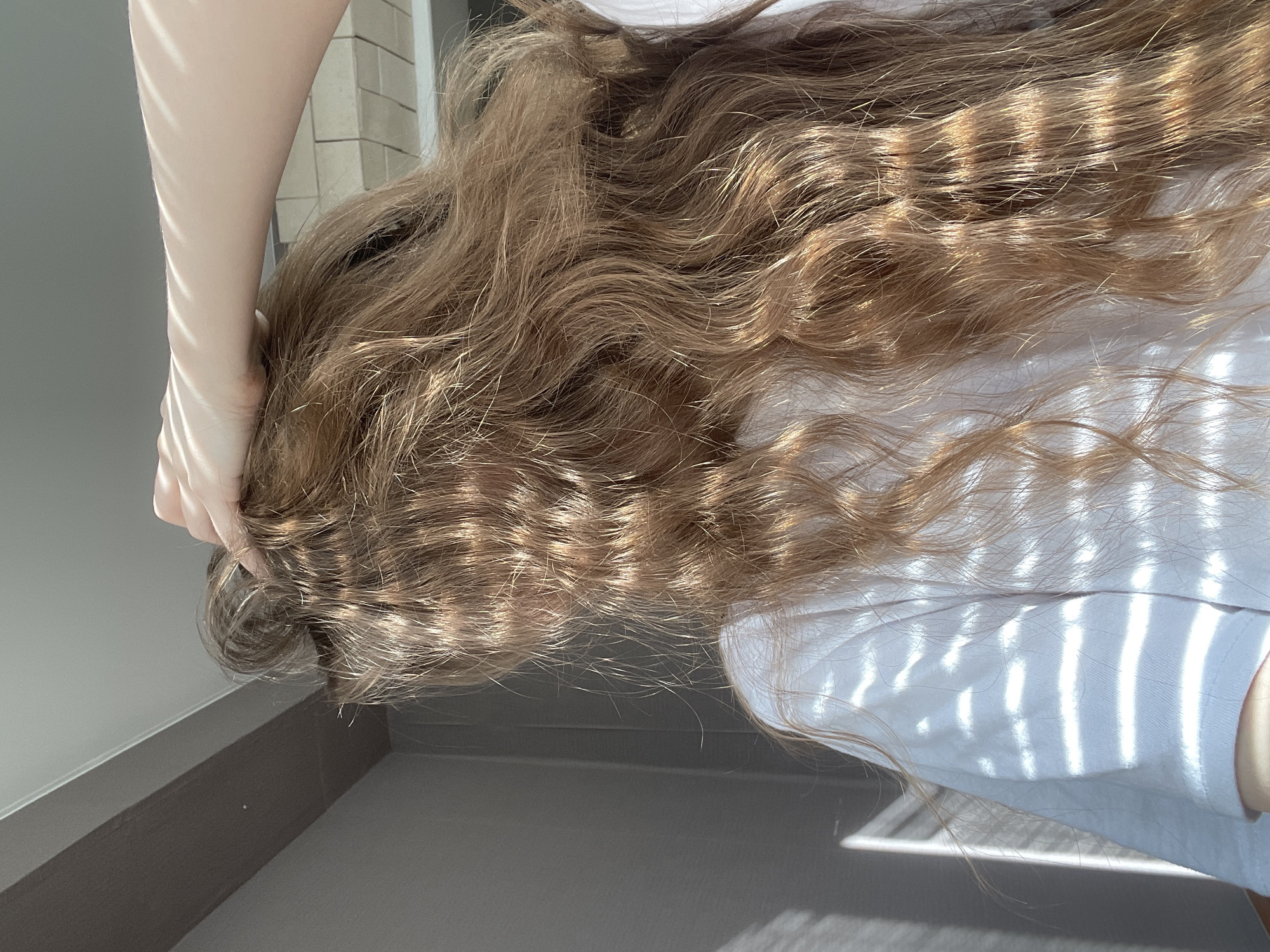 Woman documents personal moments indoors in Ufa, Russia