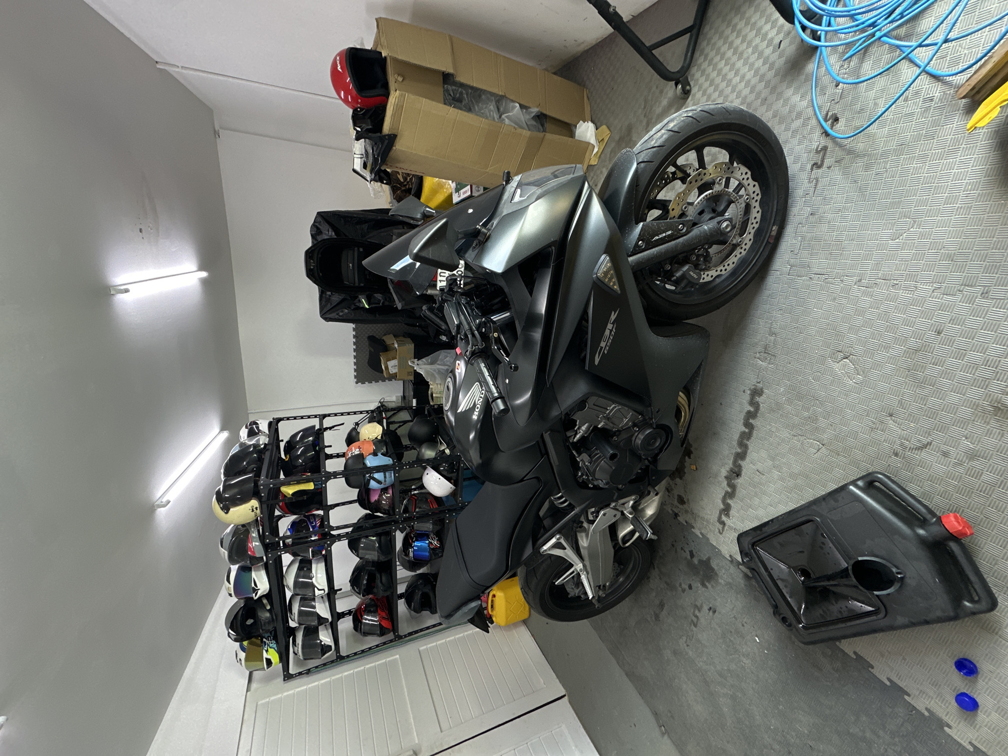 Motorcycles and gear at a Karon storage spot, early morning