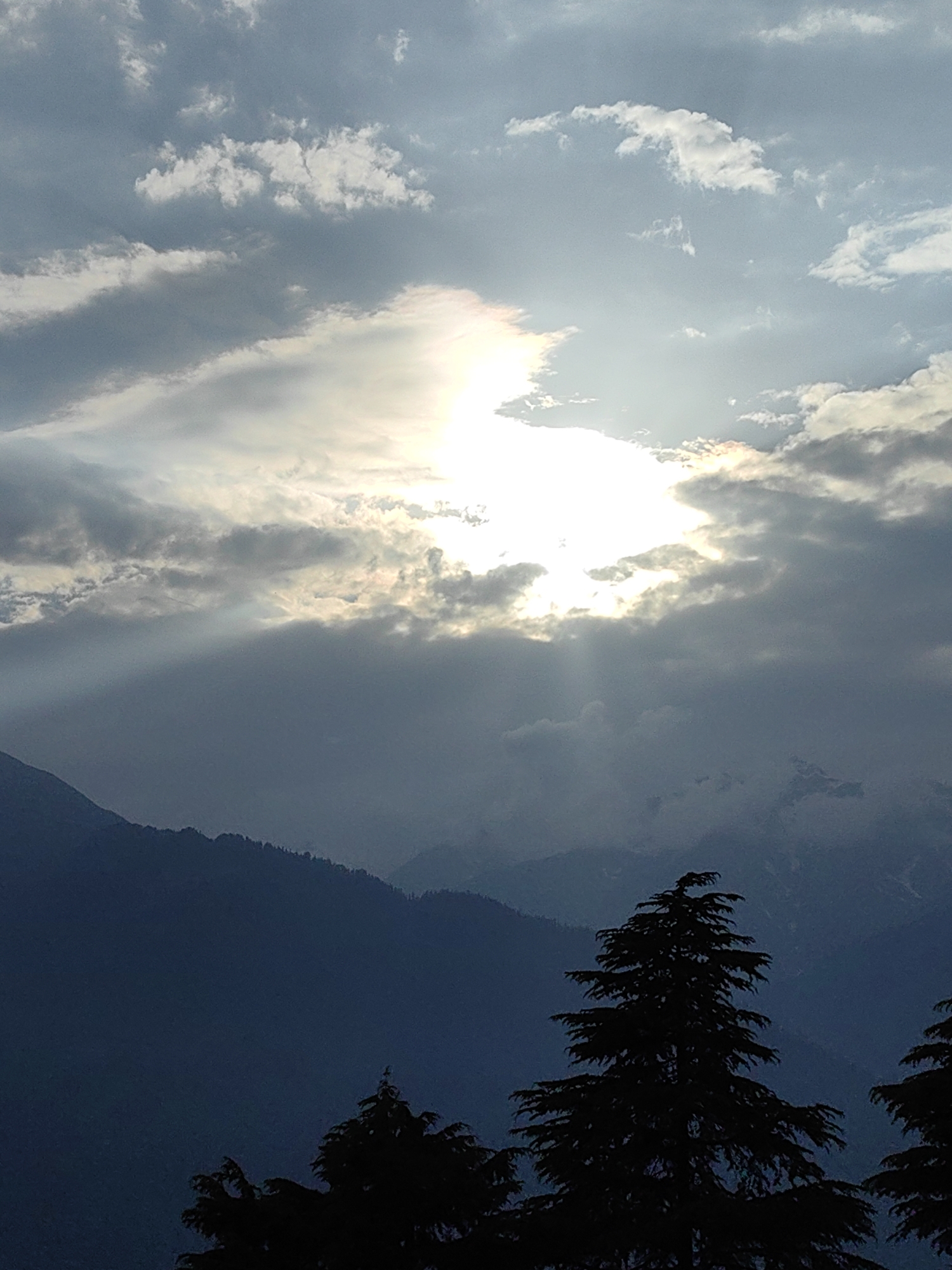 Mountain landscapes and dramatic skies above Prini, Himachal Pradesh