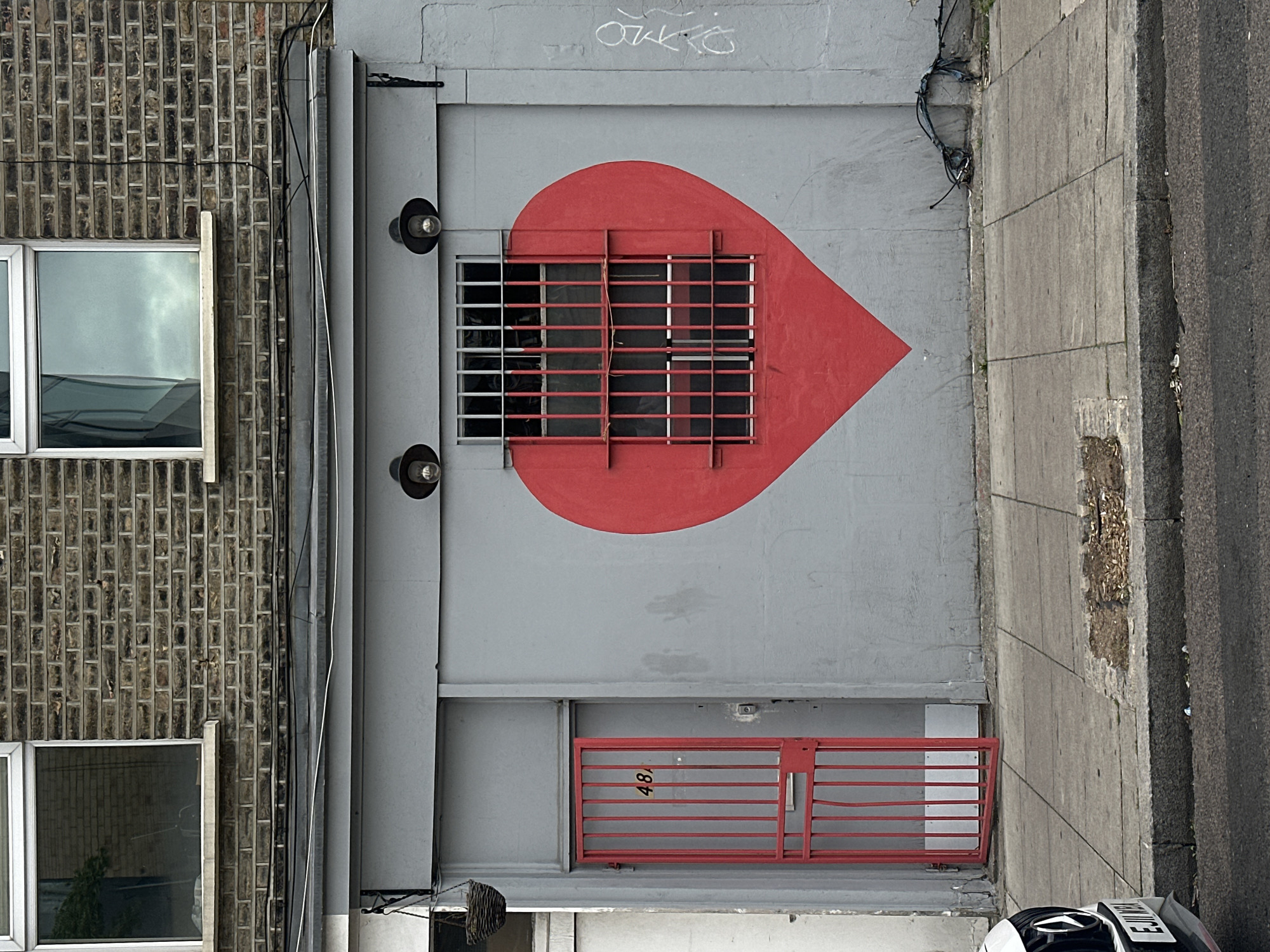 Red heart street art spotted on London building wall