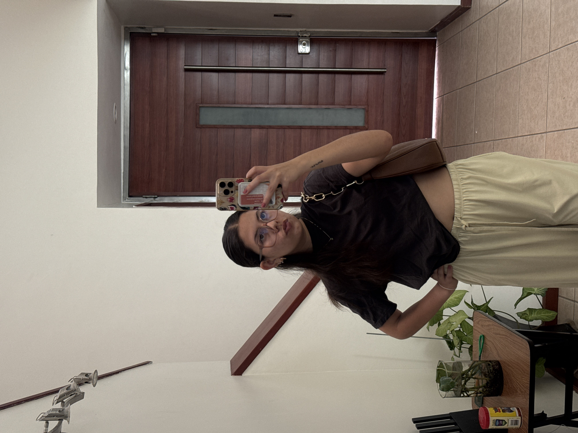 Woman takes selfies indoors in Puebla, Mexico