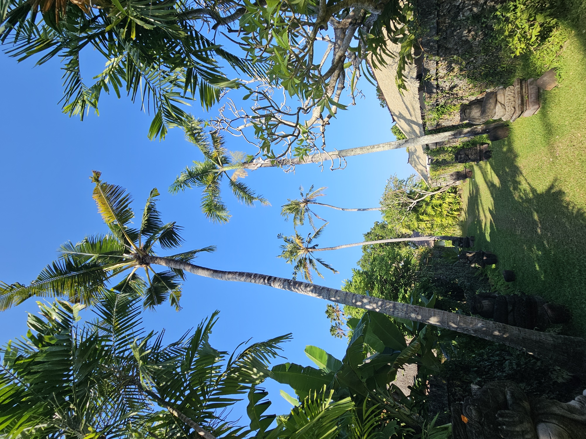 Strolling a lush Balinese temple garden in Denpasar