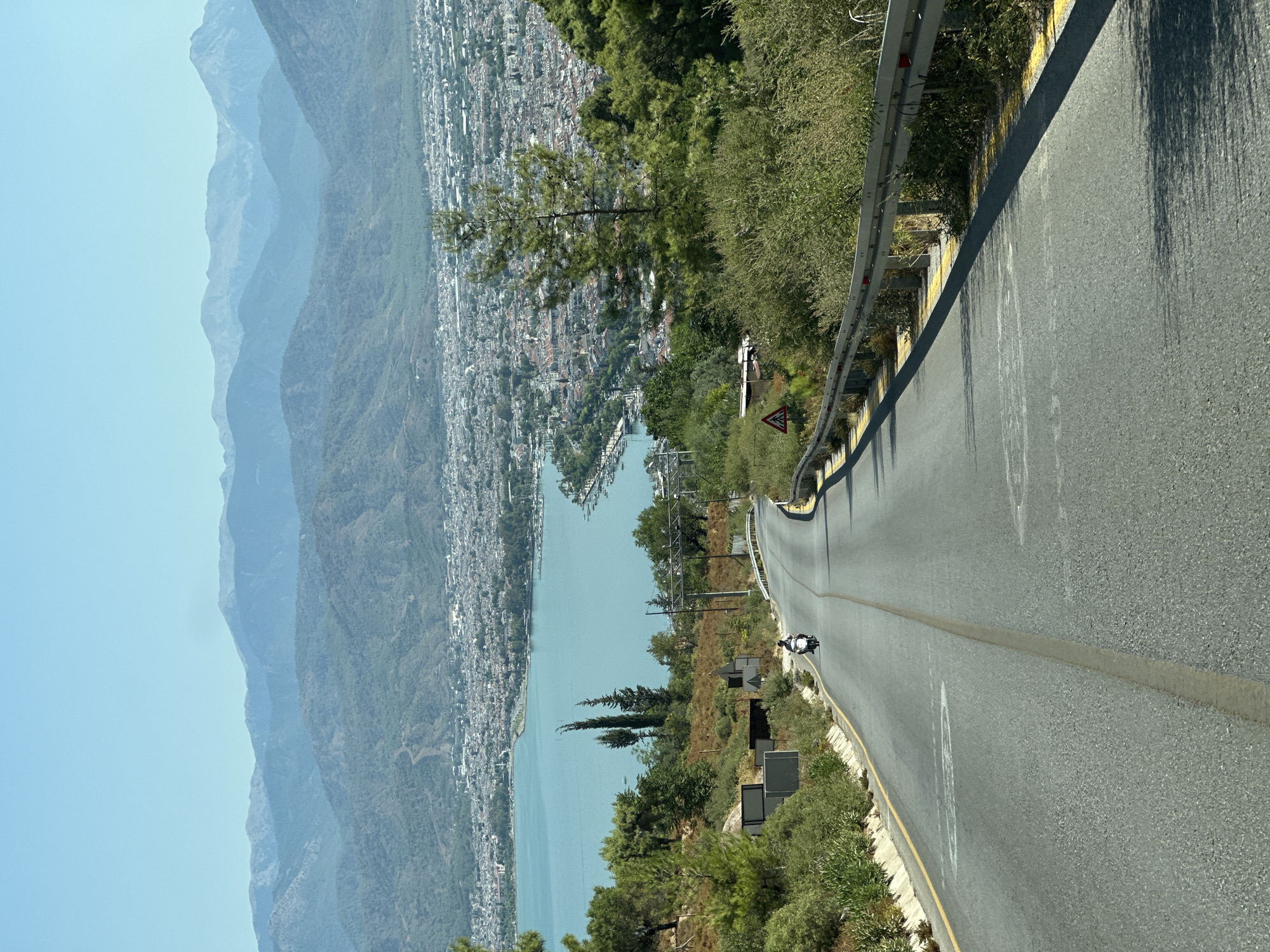 Hilltop road curves above Fethiye's bay, Turkey