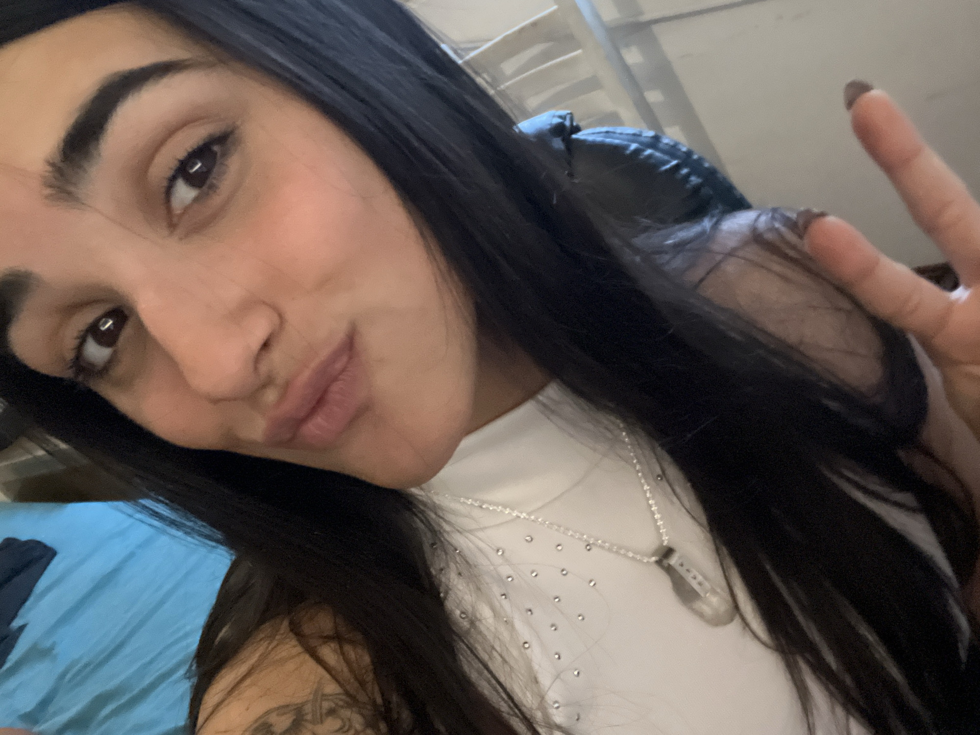 Woman takes peace sign selfie in Buenos Aires