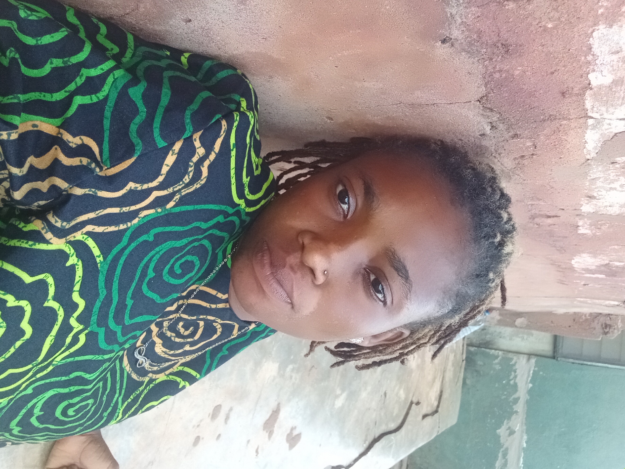 Unidentified person with dreadlocks captured in close-up portrait