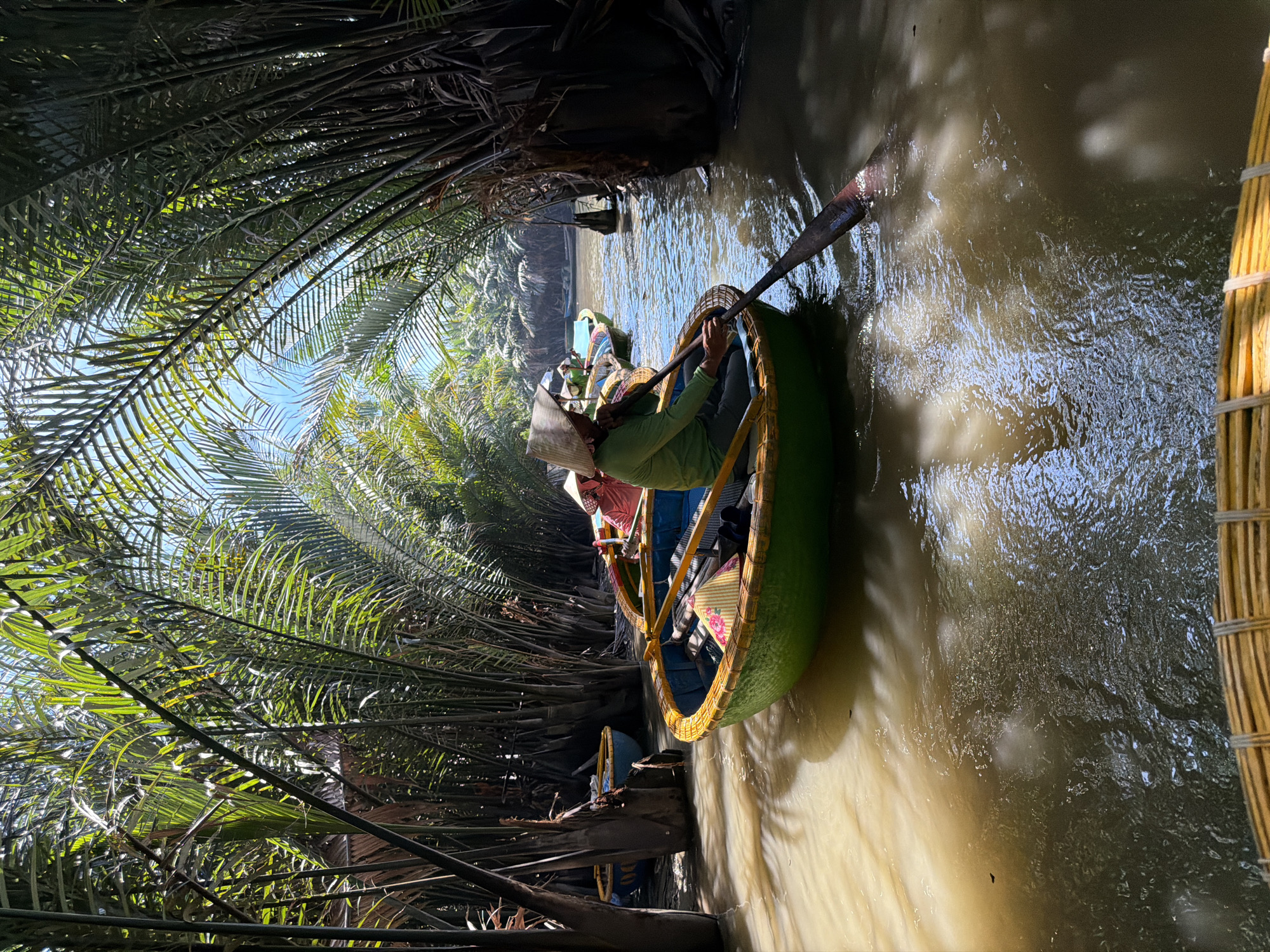 Traditional basket boat tour through Vietnamese coconut forest waterways
