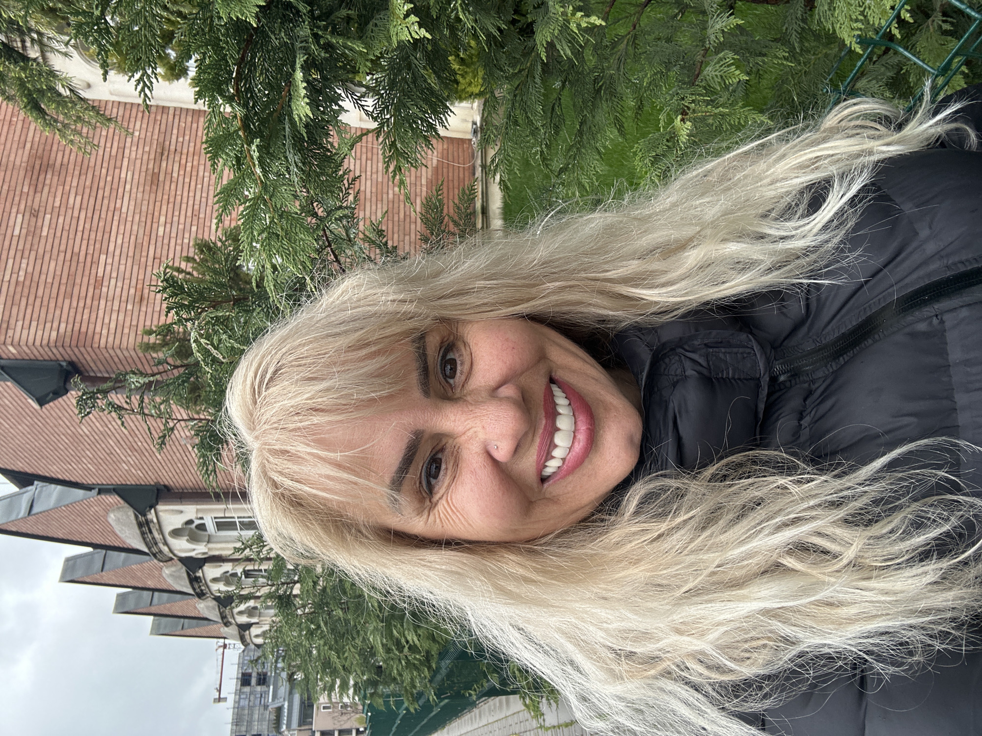 Woman photographed smiling in Sofia with urban backdrop