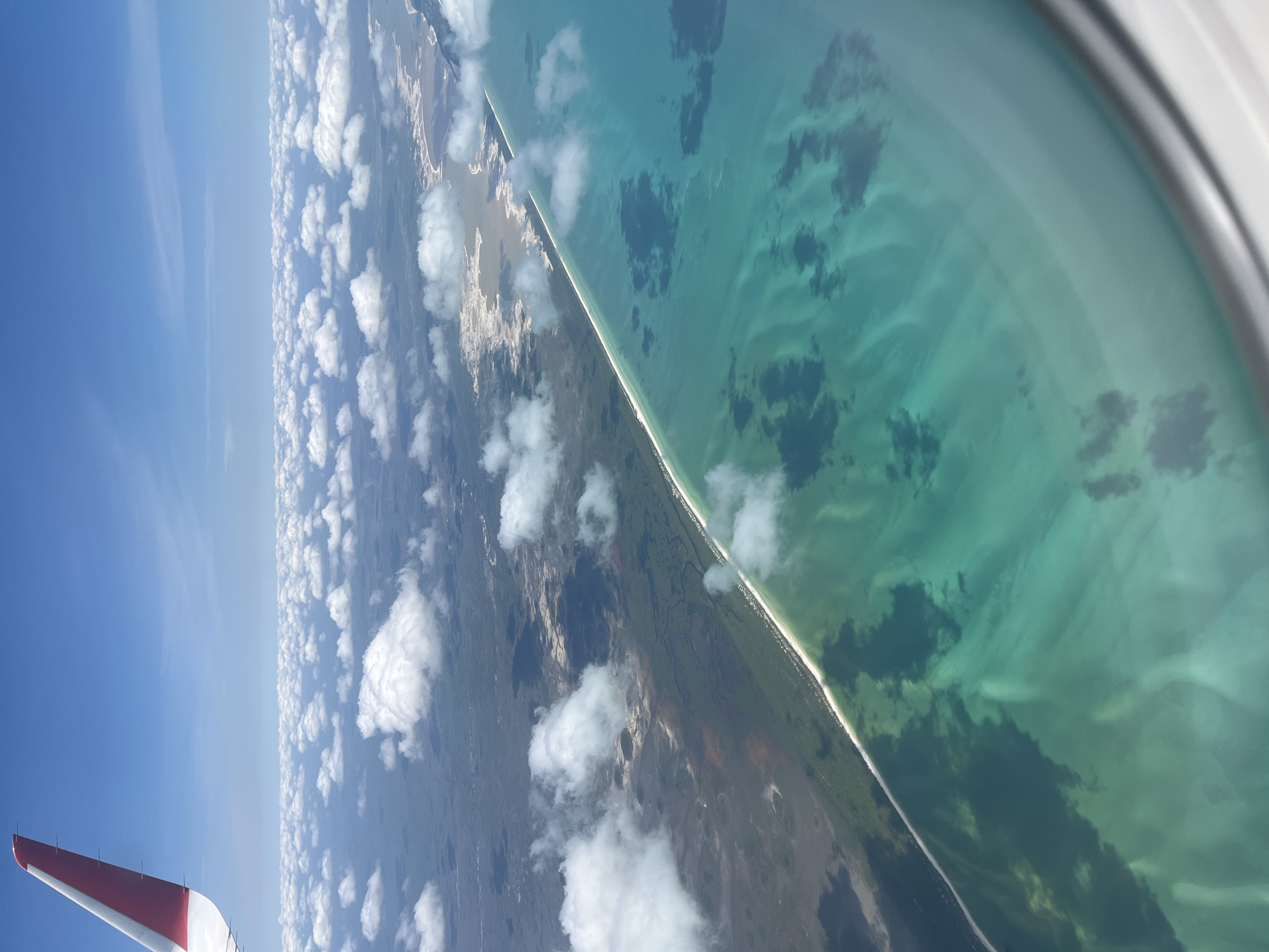 Aerial coastal view captured from airplane near Xuilub, Mexico