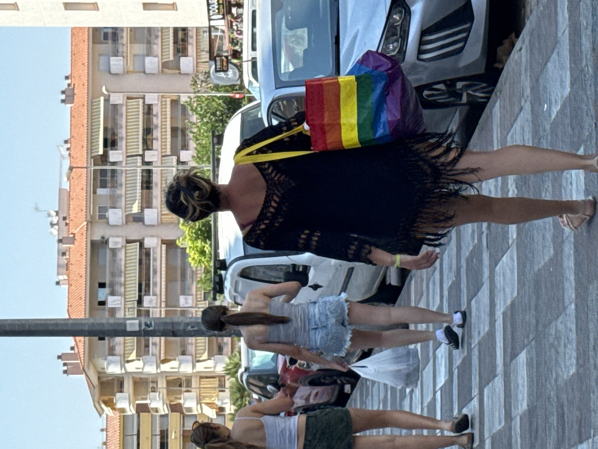 Blanes market scene with local police and souvenir stalls