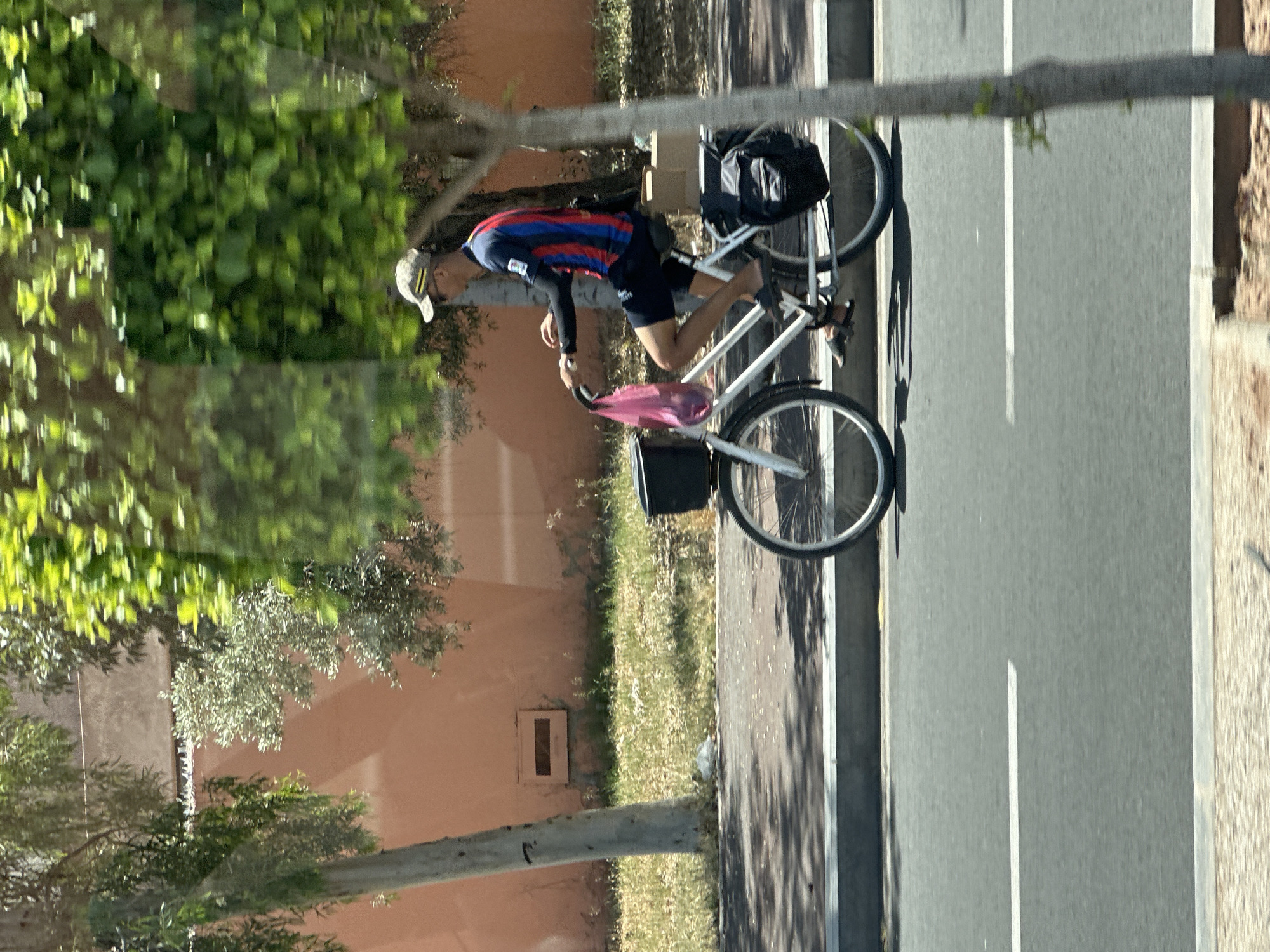Cyclist spotted on Marrakesh street near fortified wall