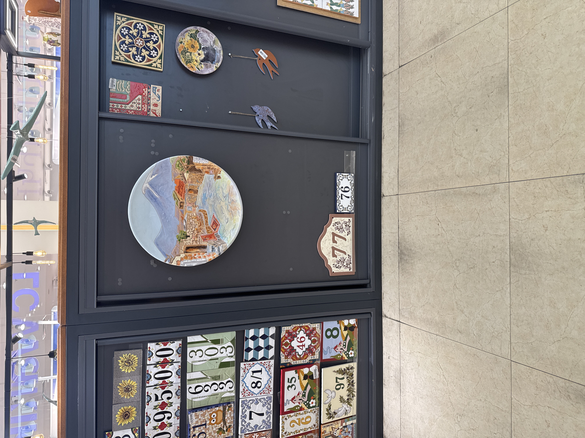Ceramic art and decorative plates on display in Yerevan shop