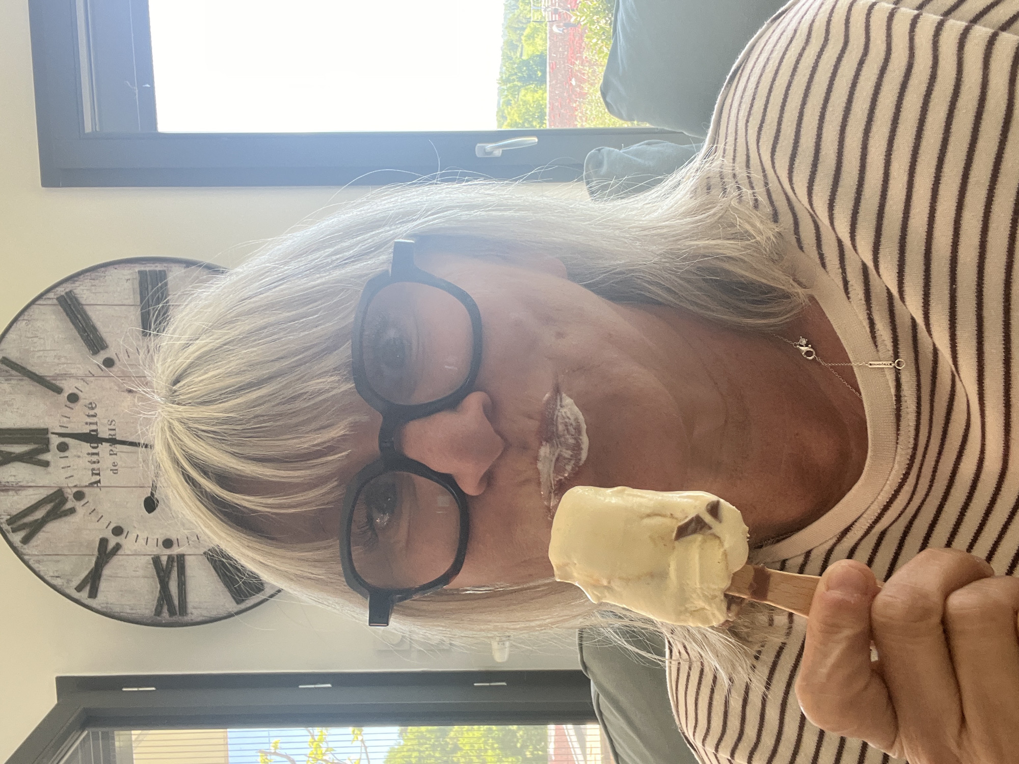 Woman enjoys food tour, takes selfie in French village