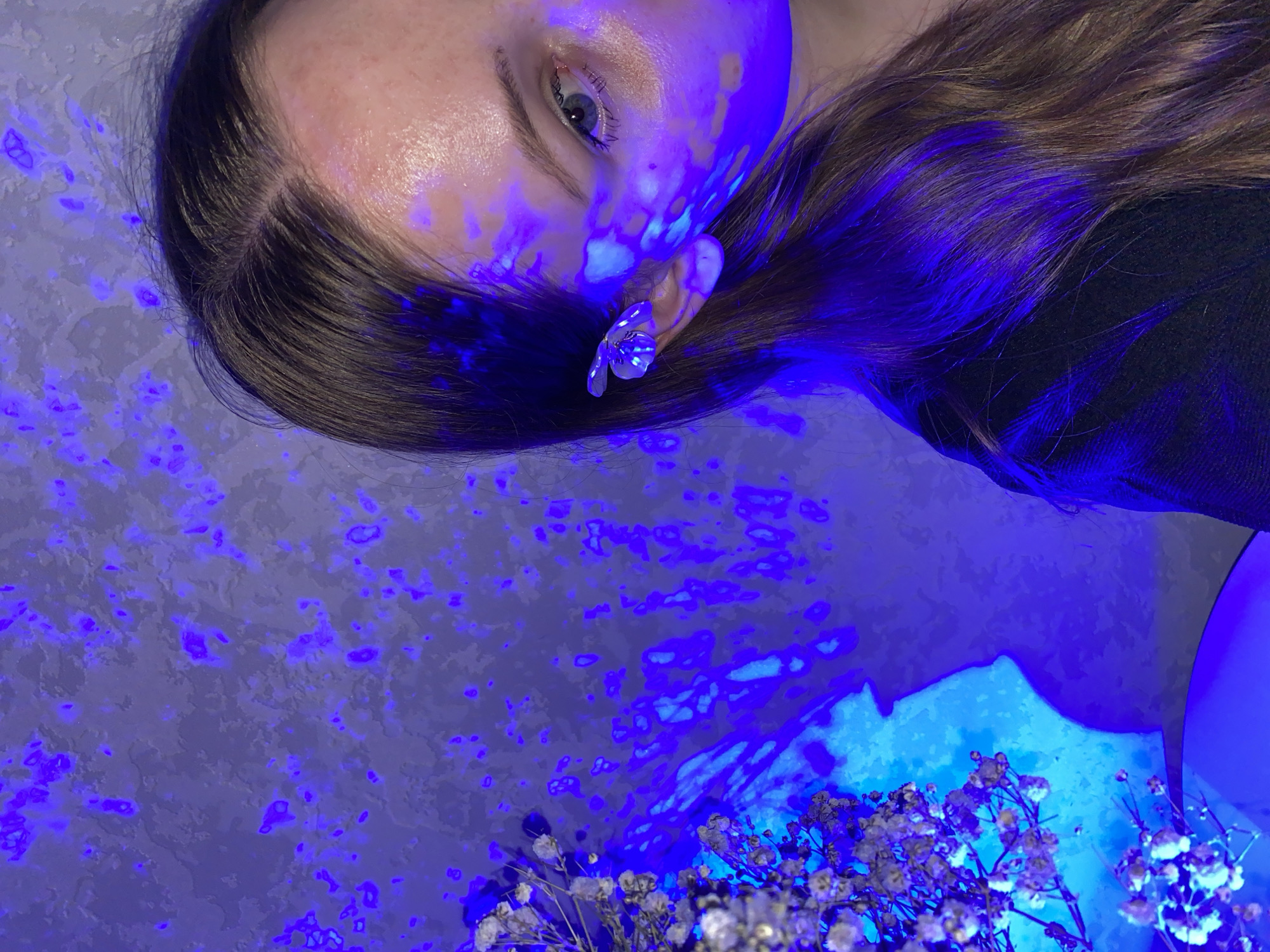 Person takes selfies under colored lighting in Izhevsk