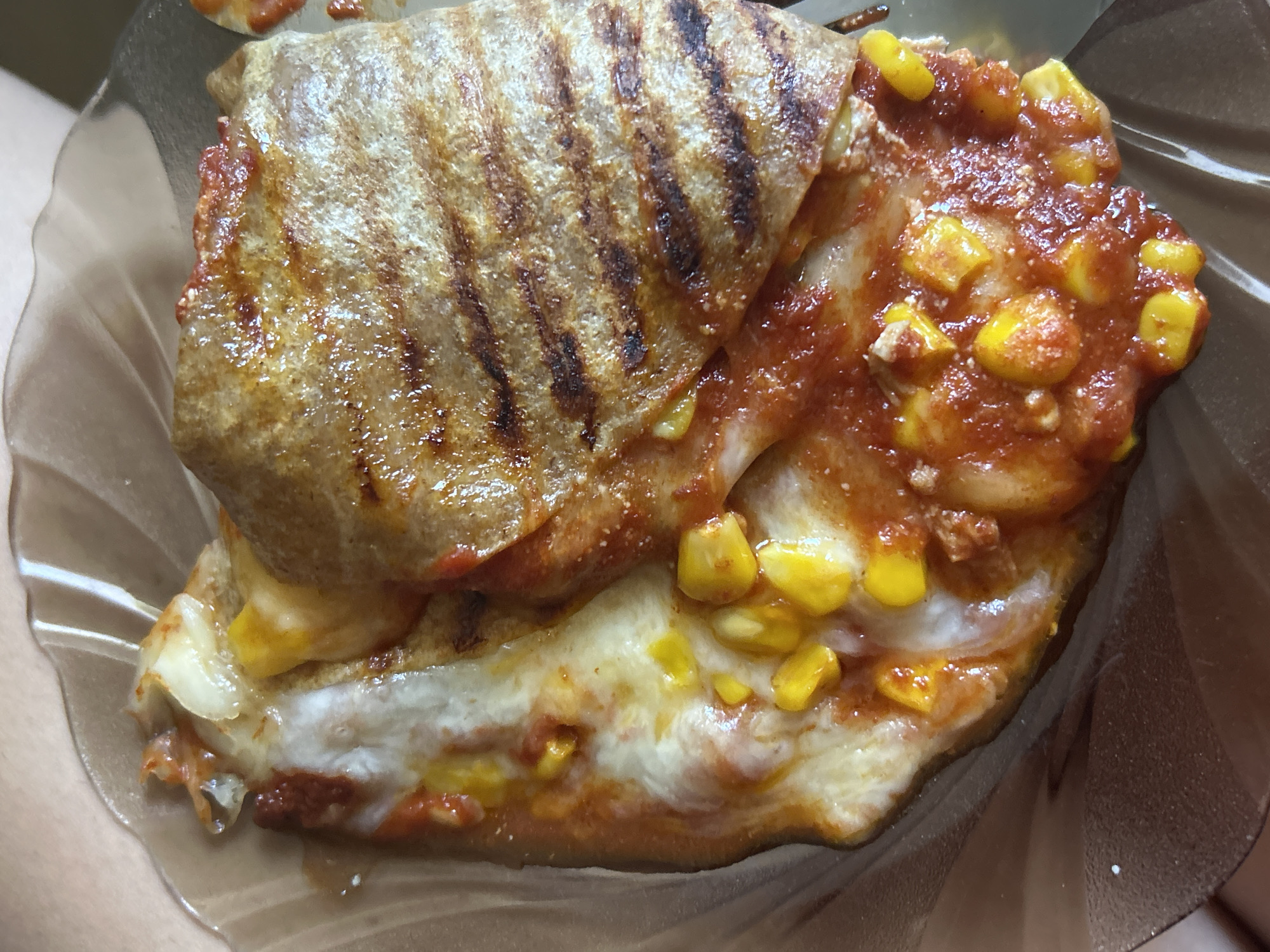 Cheesy grilled quesadilla with corn and red sauce in Sofia