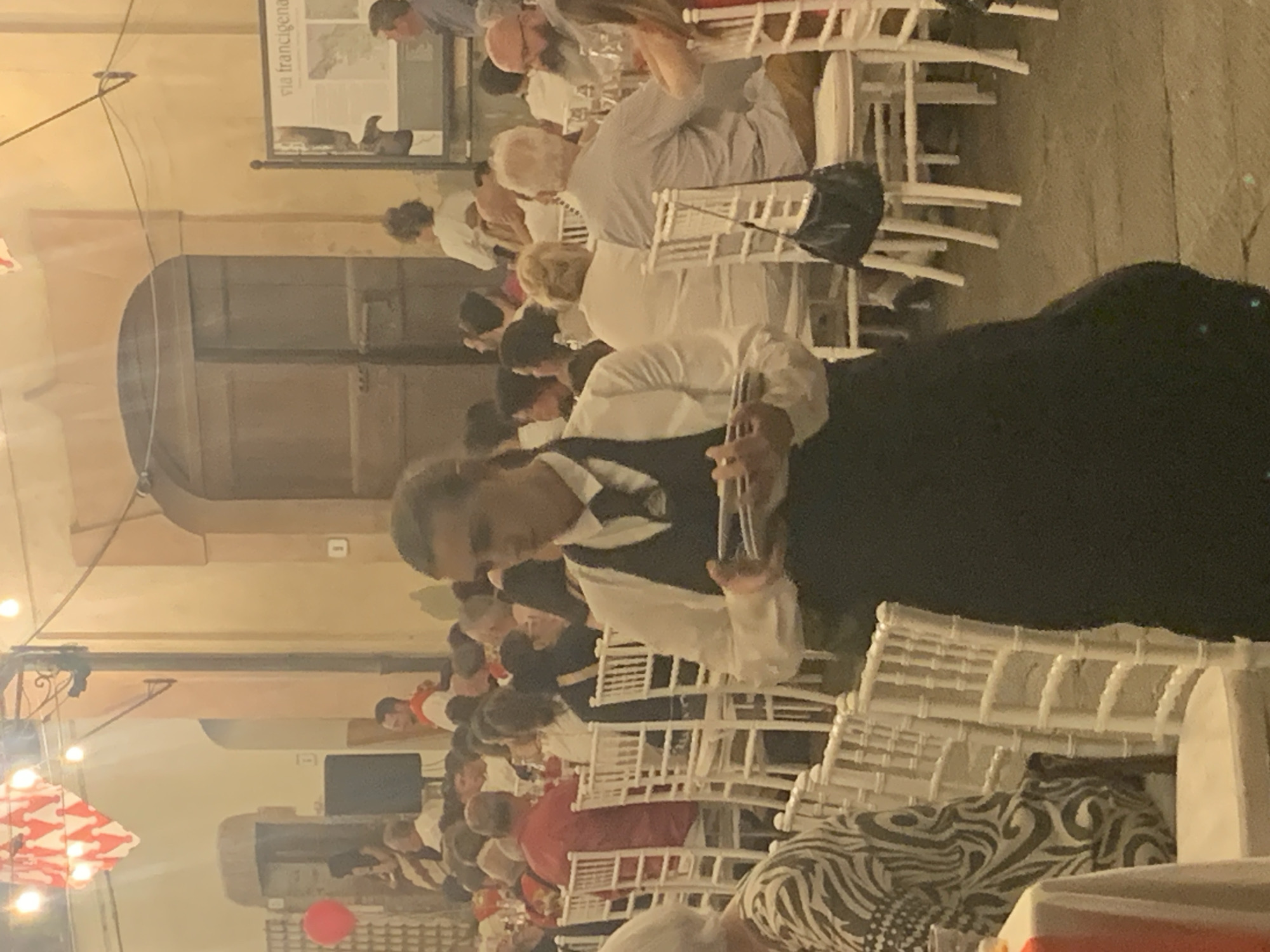 Summer evening event in San Quirico d'Orcia's cobblestone streets