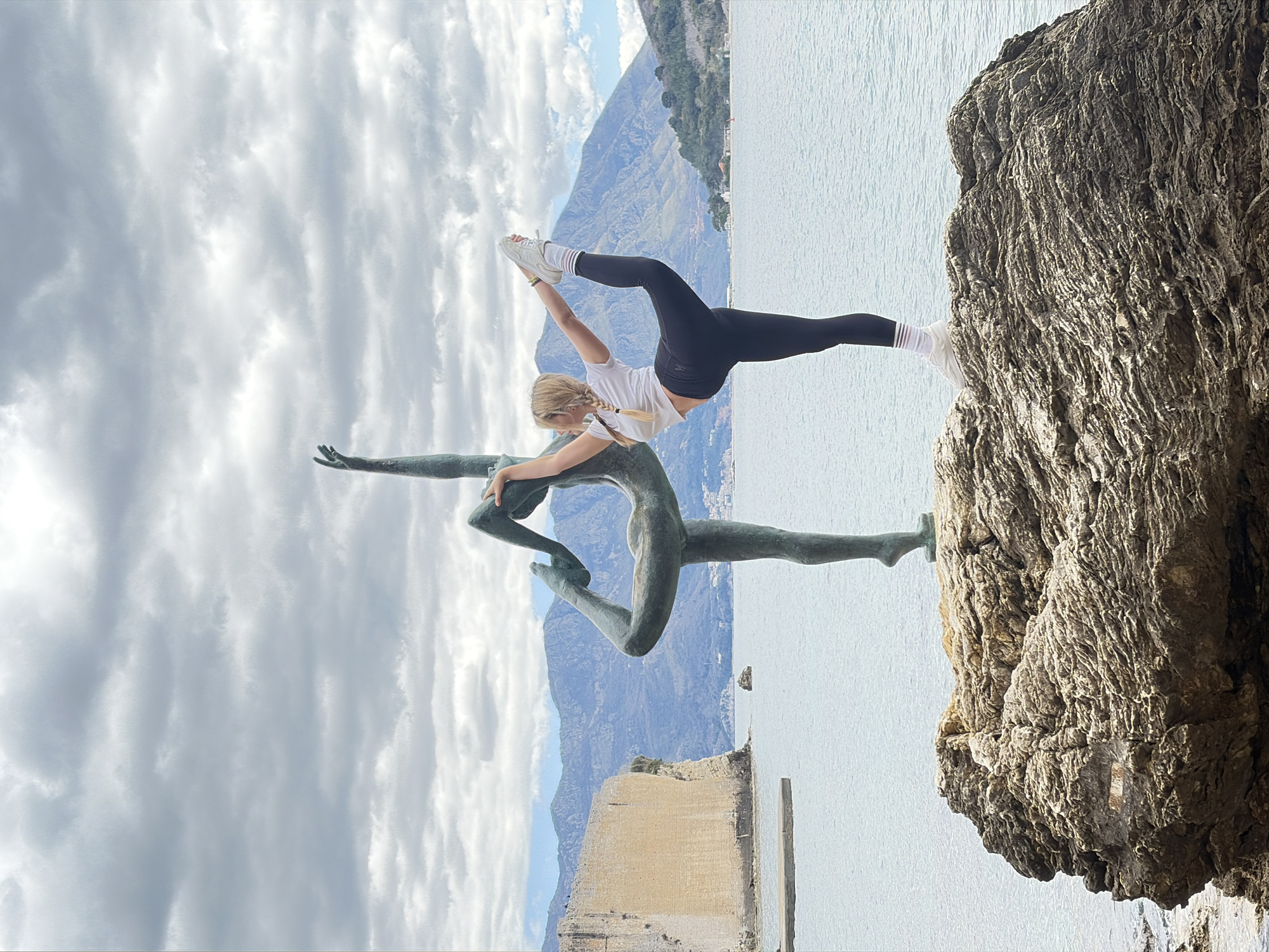 Family tourism day captured around Budva's famous ballerina statue